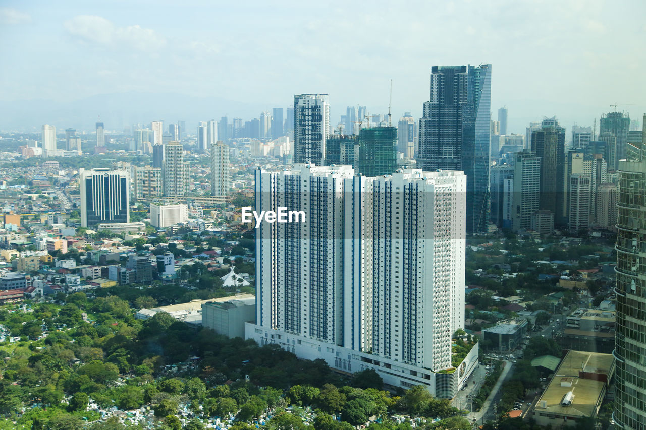 Modern buildings in city against sky