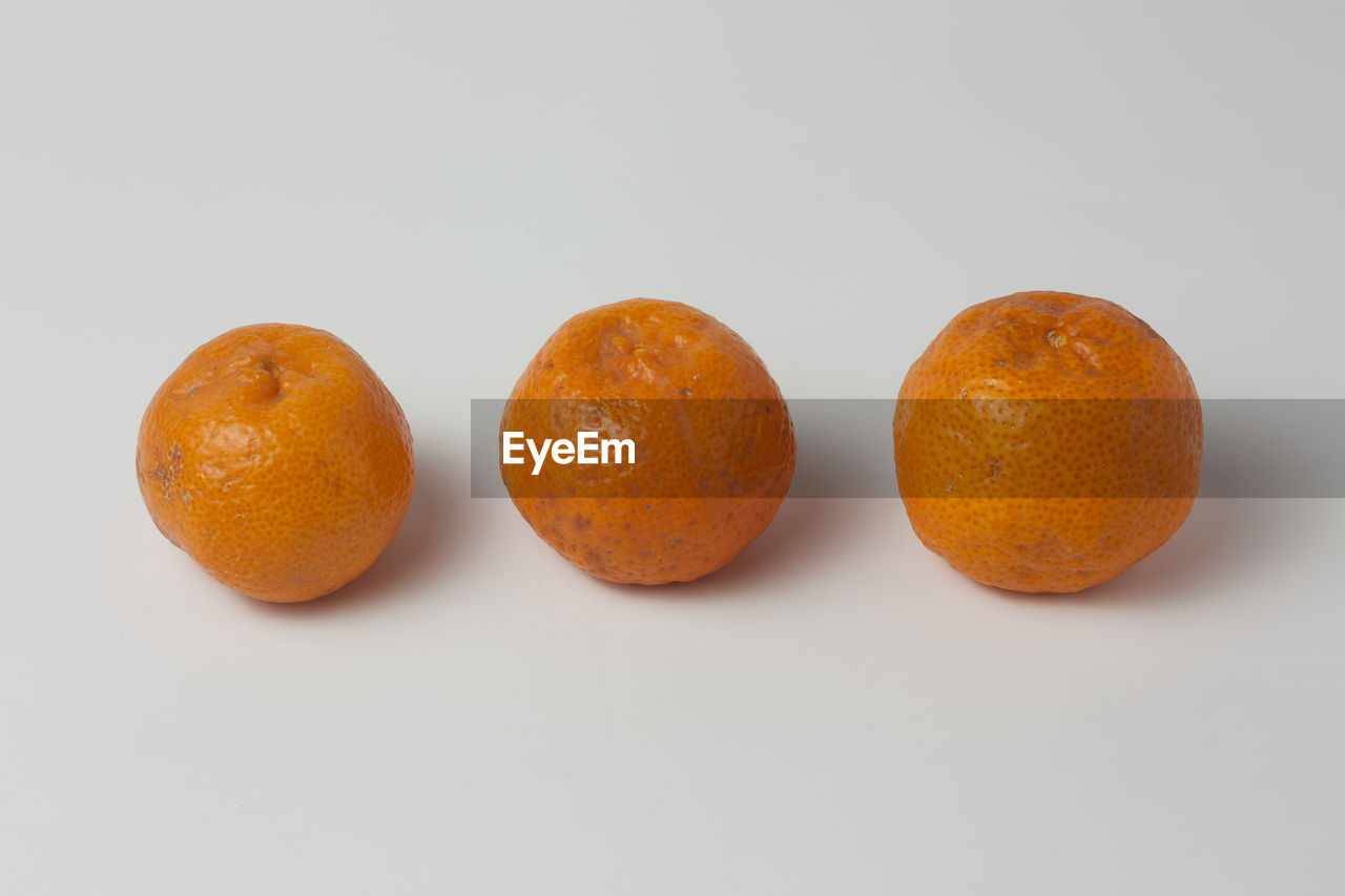 Orange fruits on white background