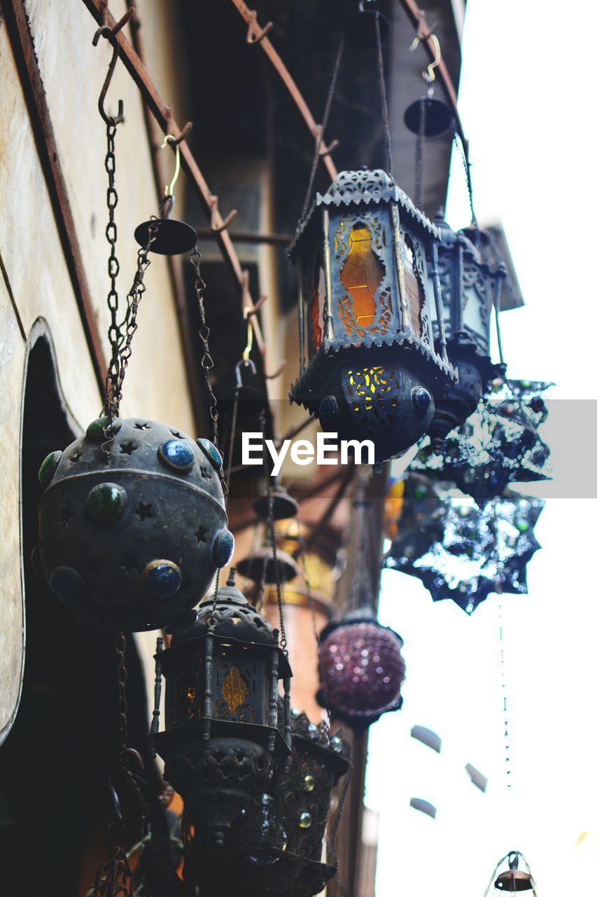 Low angle view of lanterns hanging on metal