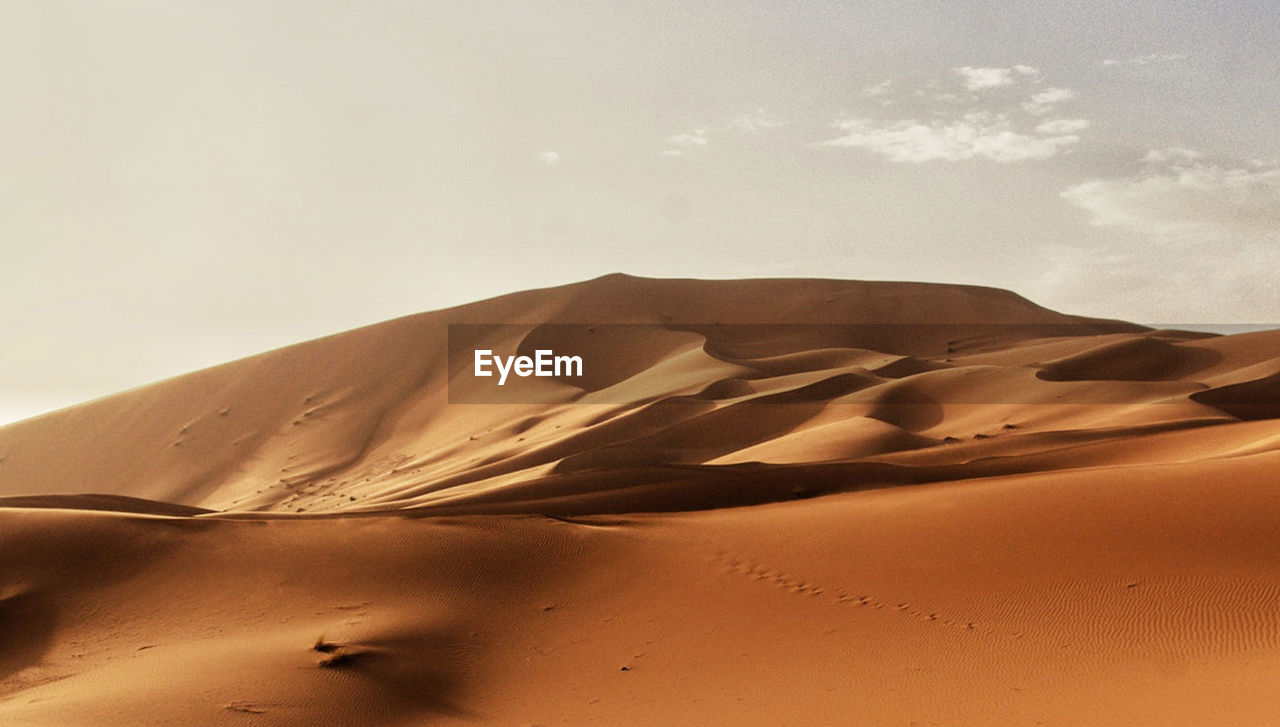 Scenic view of desert against sky