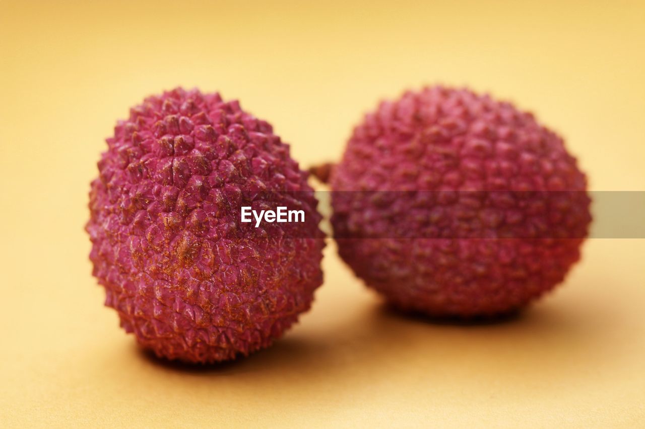 CLOSE-UP OF STRAWBERRY ON TABLE