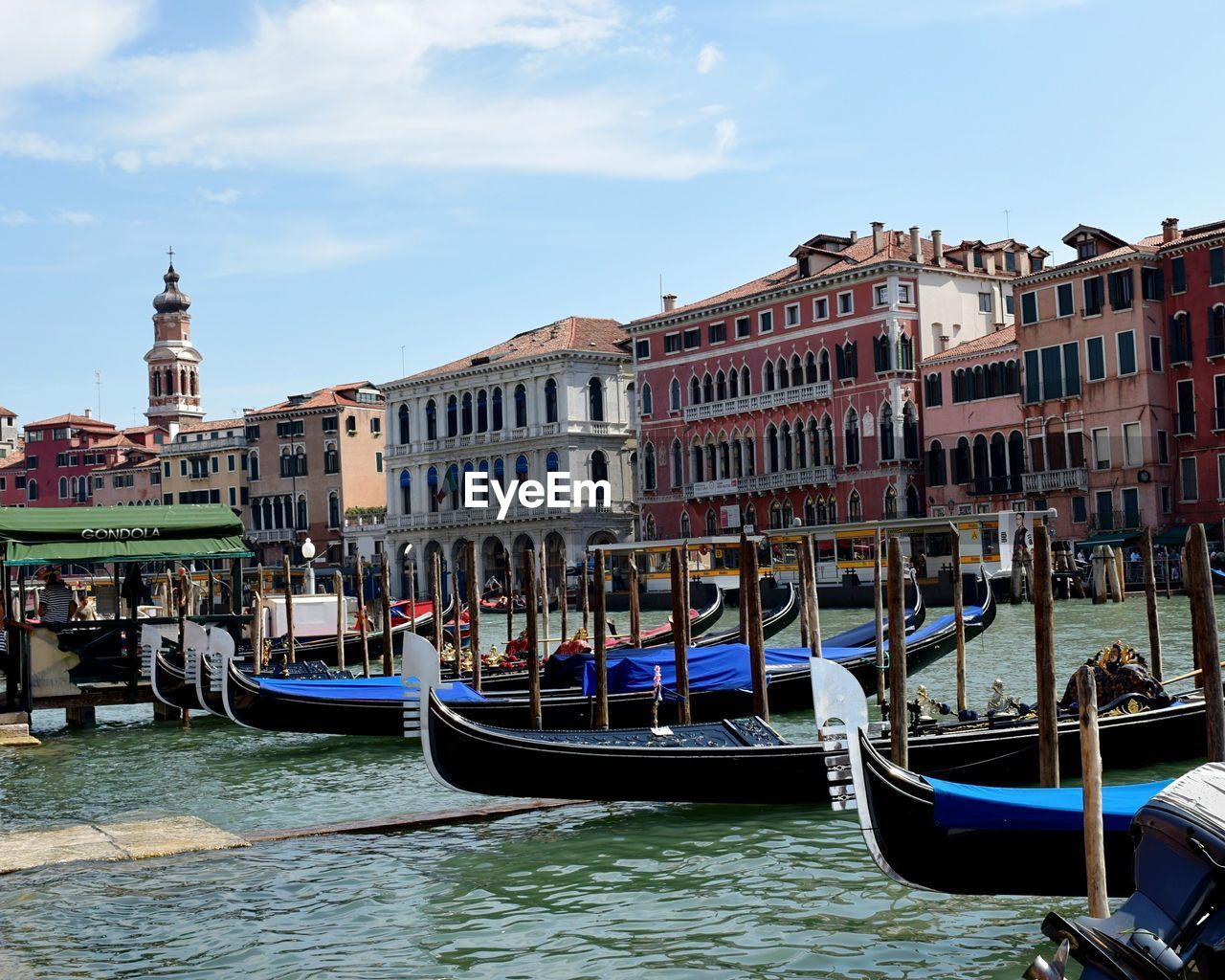 VIEW OF BOATS IN CANAL AGAINST BUILDINGS