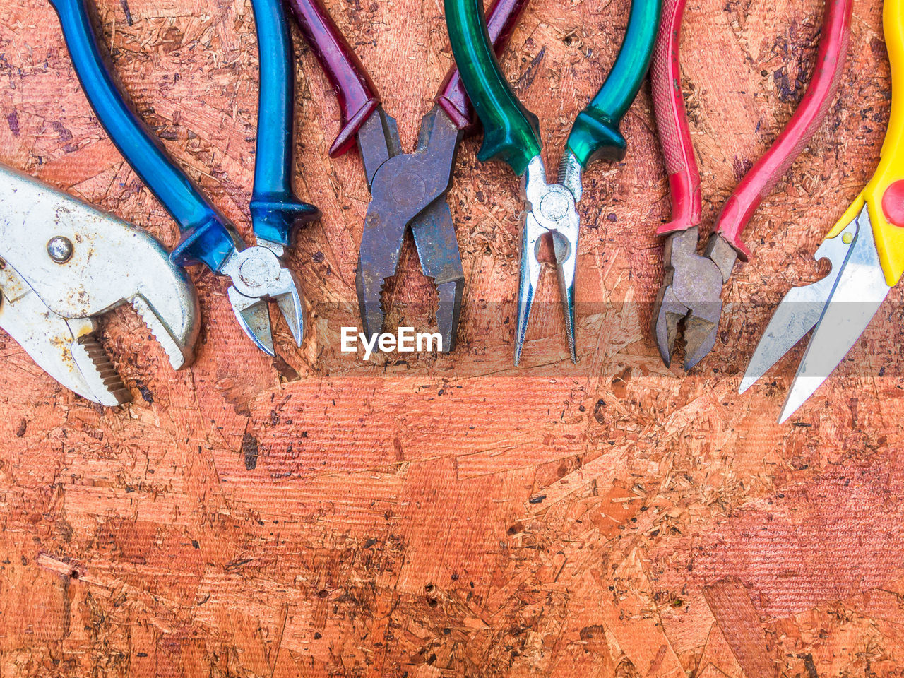 Directly above shot of various pliers on table