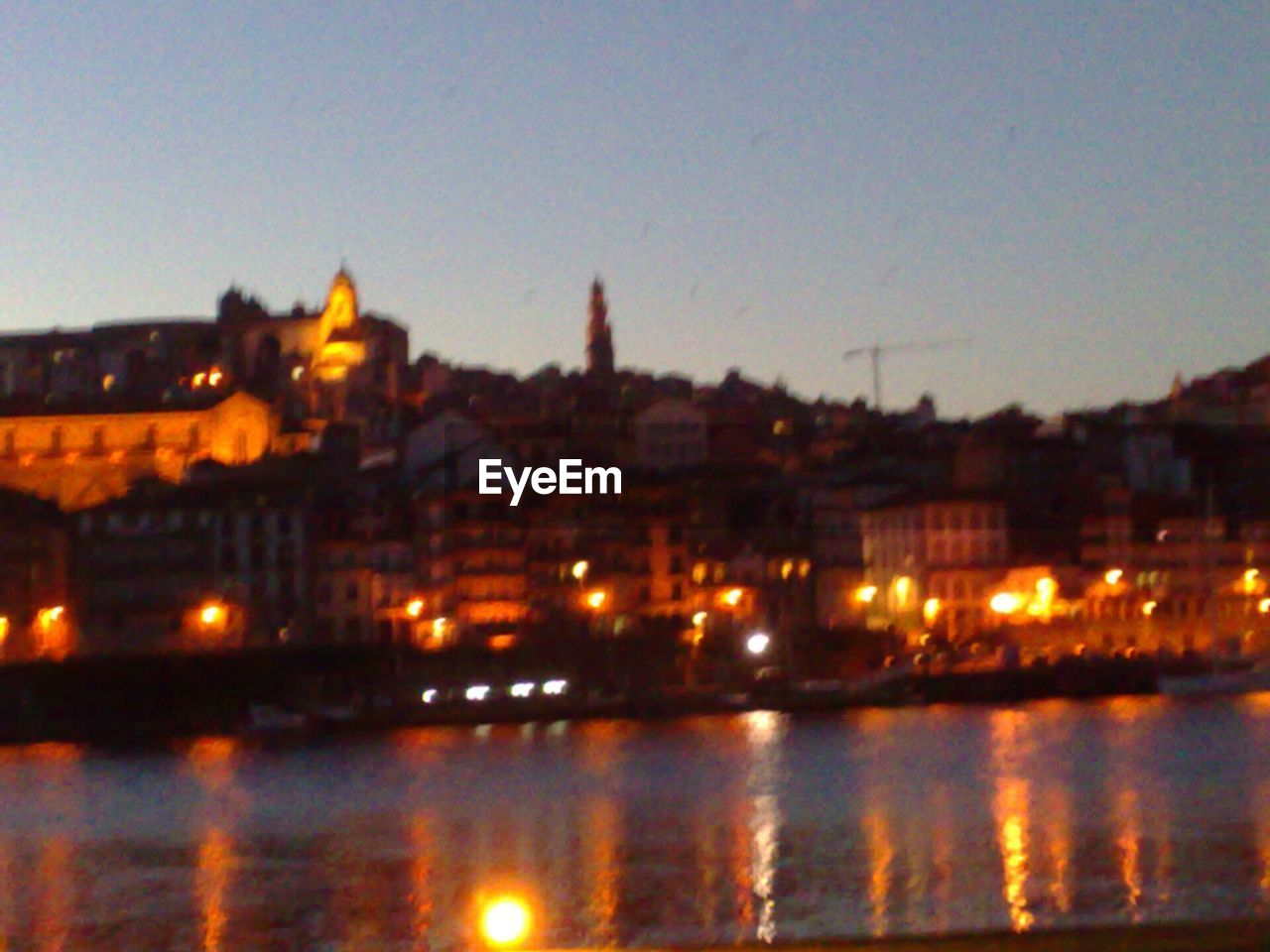 VIEW OF ILLUMINATED CITYSCAPE AT NIGHT