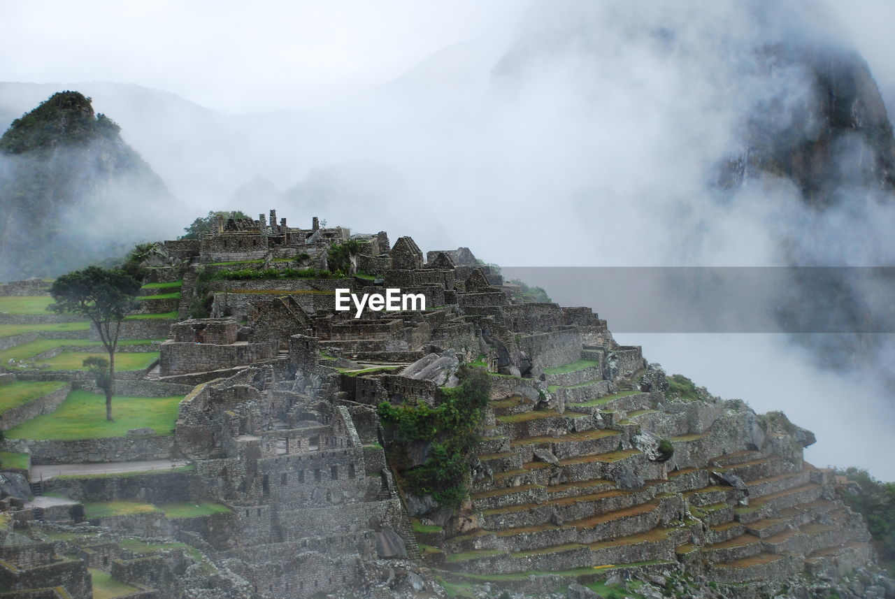 Scenic view of machu picchu in foggy weather