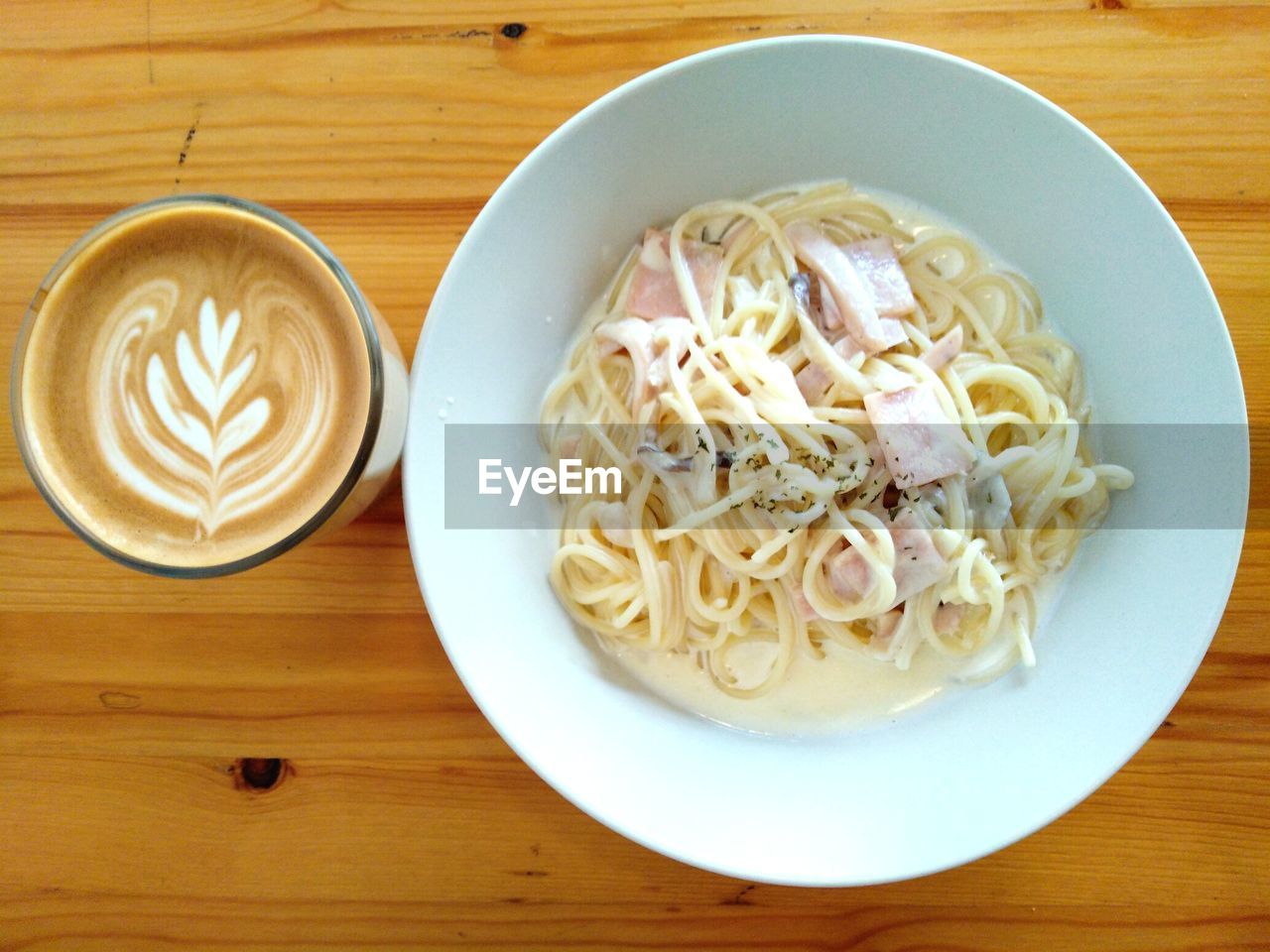 HIGH ANGLE VIEW OF NOODLES WITH COFFEE AND BREAD