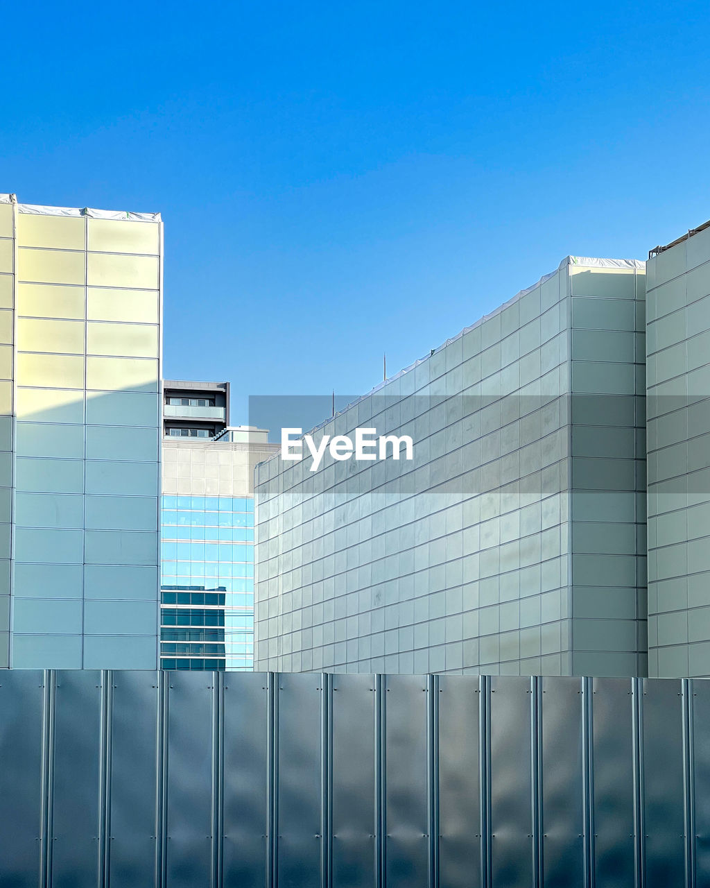 architecture, building exterior, built structure, facade, building, blue, sky, city, office building exterior, headquarters, office, business, tower block, clear sky, no people, commercial building, nature, skyscraper, day, outdoors, industry, glass, corporate business