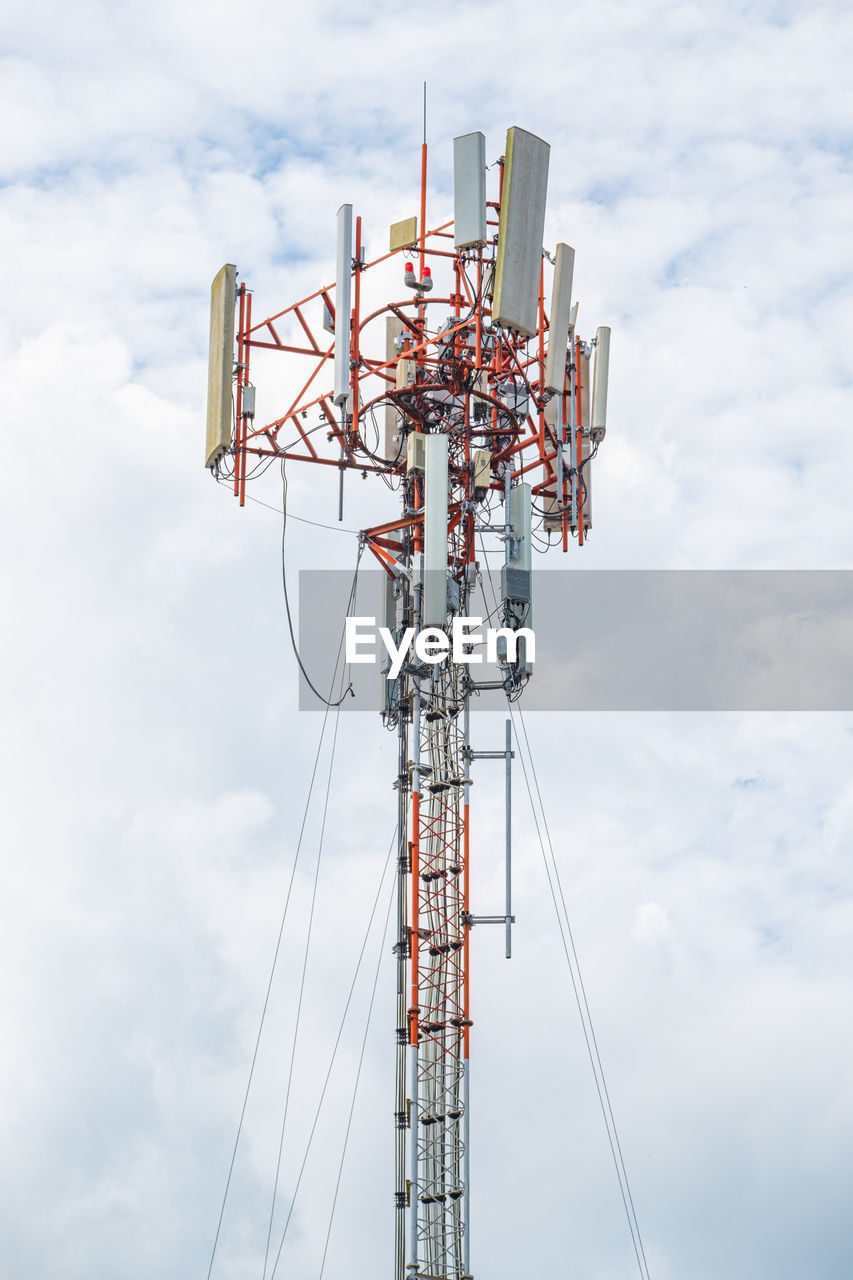 Low angle view of communications tower against sky