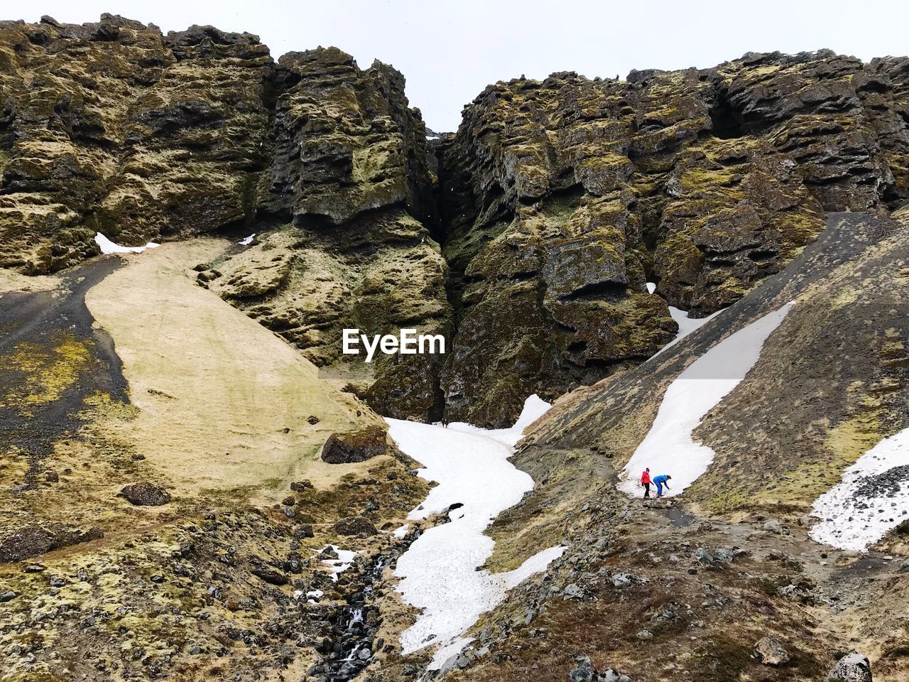 Scenic view of rocks and mountains during winter