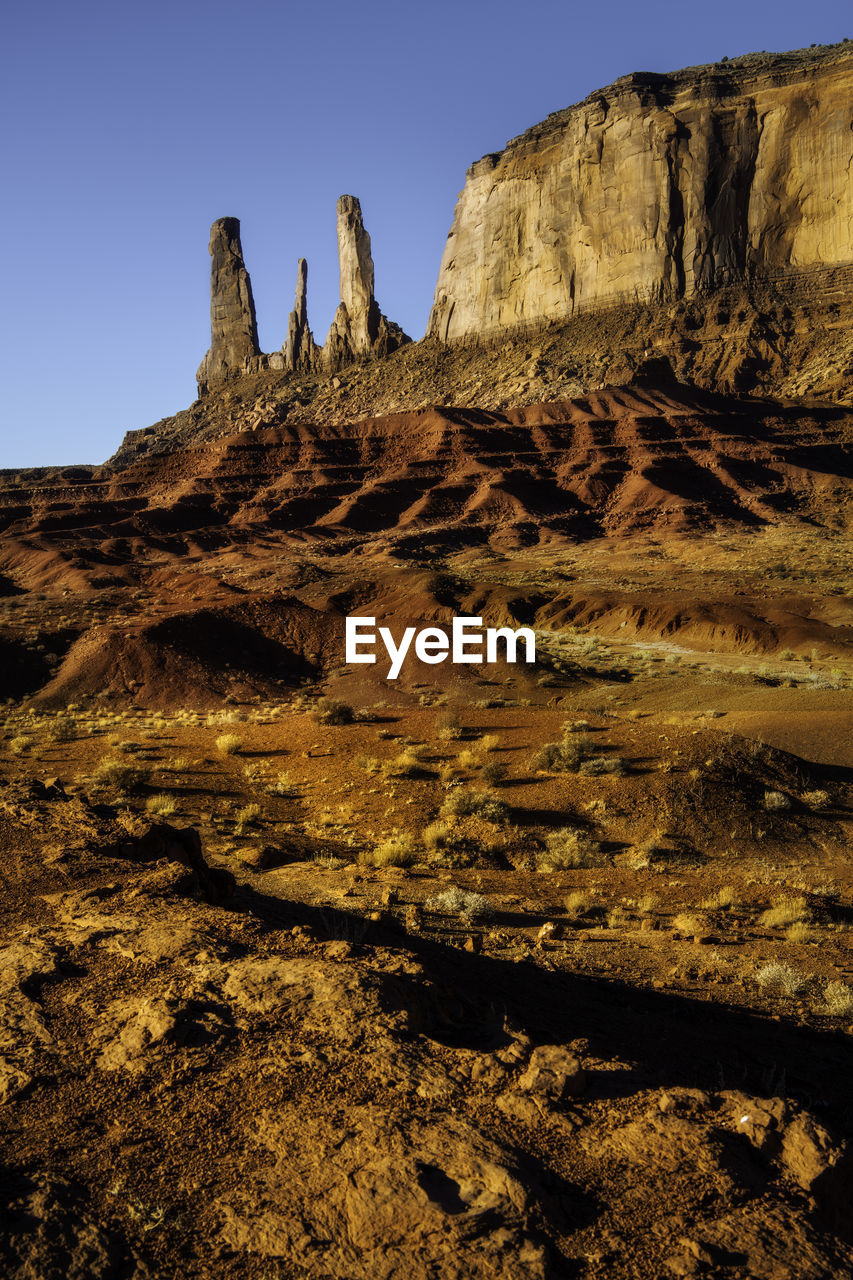 Low angle view of rock formations against sky