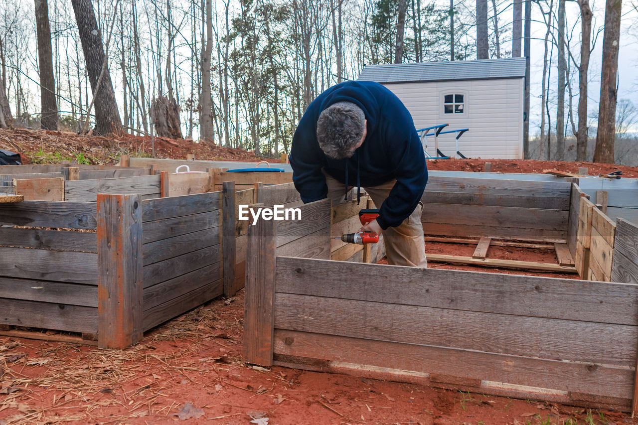 rear view of man working in workshop