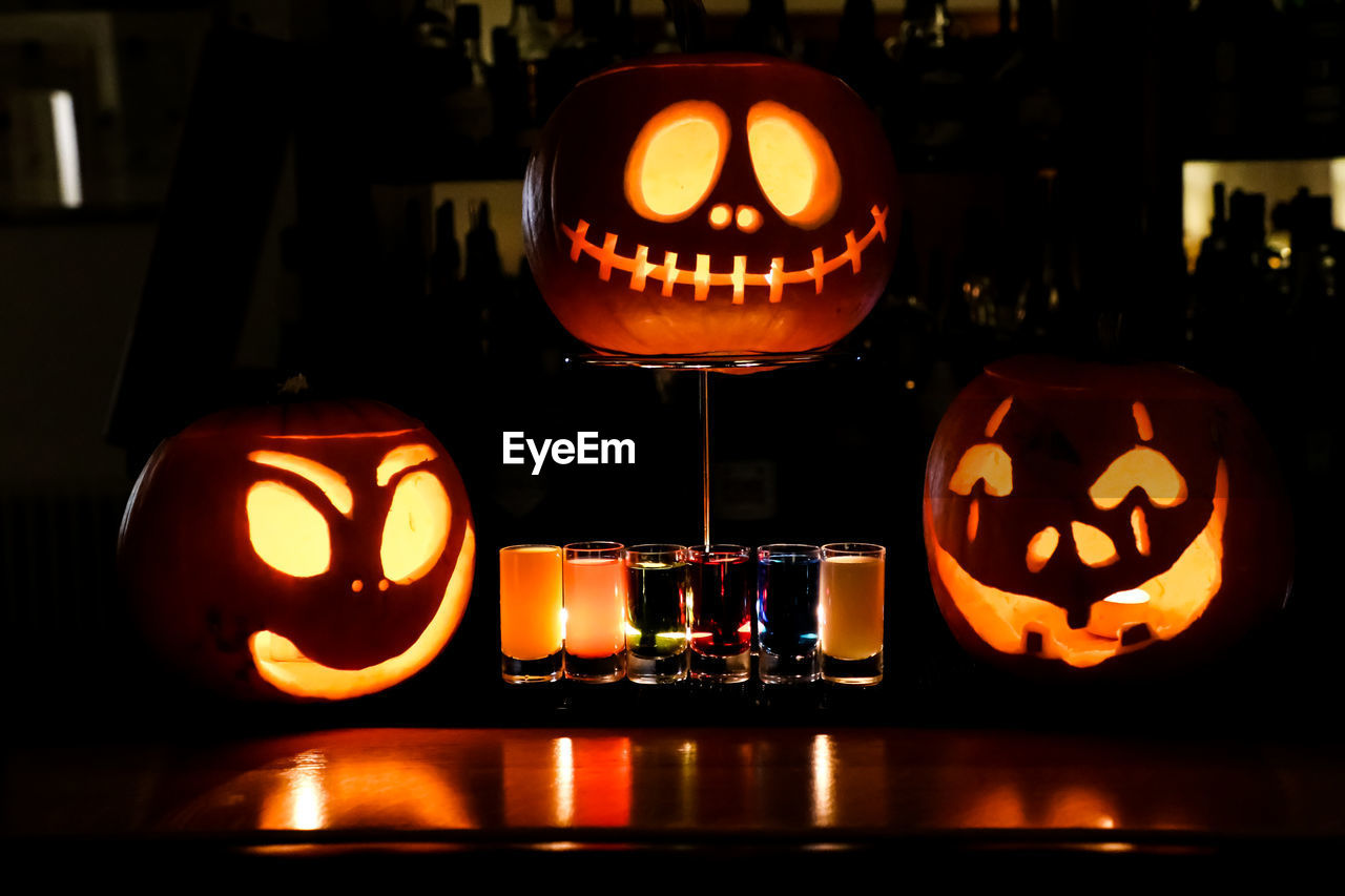 ILLUMINATED CANDLES ON PUMPKIN