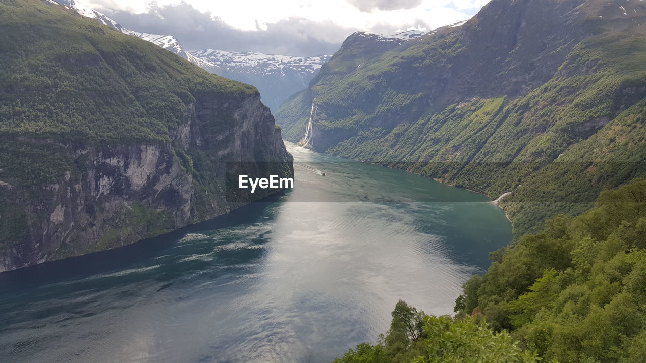 Scenic view of geirangerfjord amidst mountains