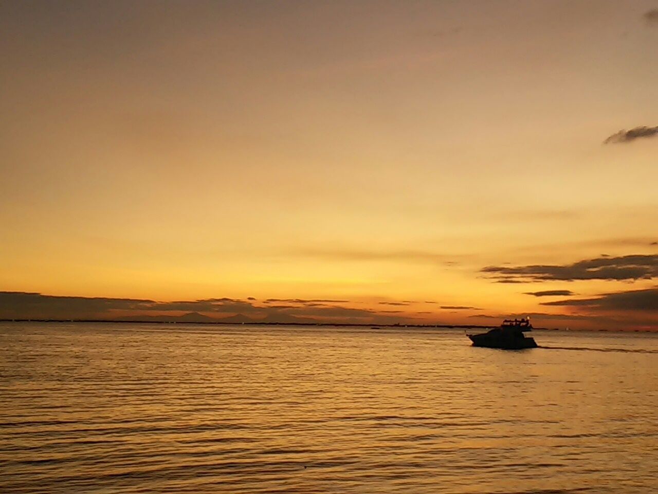 SCENIC VIEW OF SUNSET OVER SEA