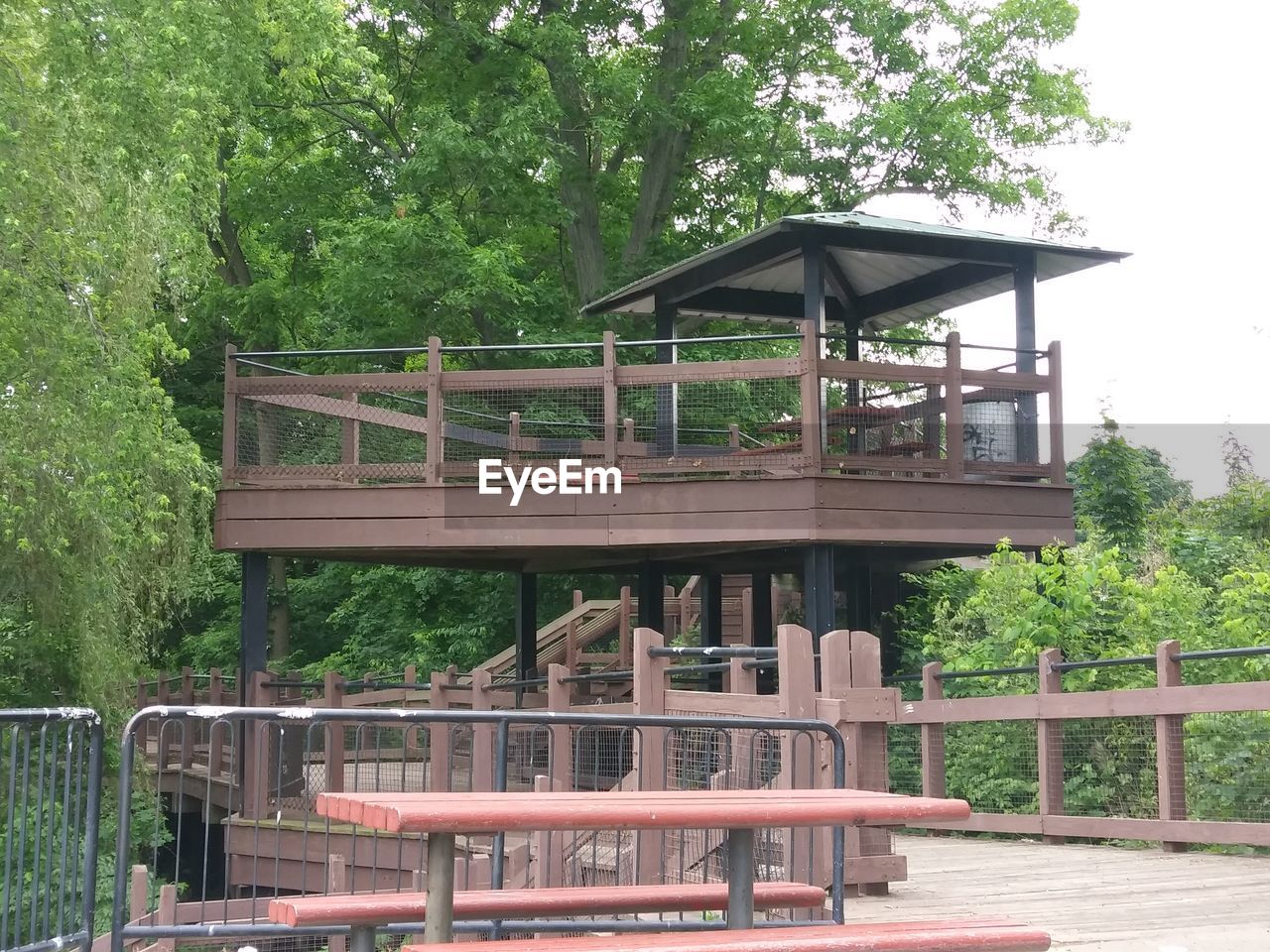 BUILT STRUCTURE BY TREES AGAINST SKY