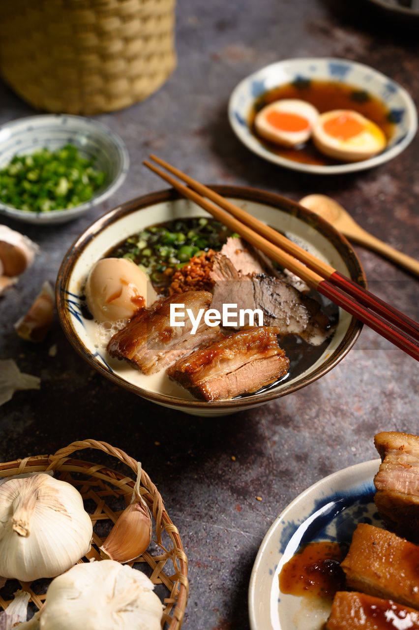 High angle view of noodles soup on table.