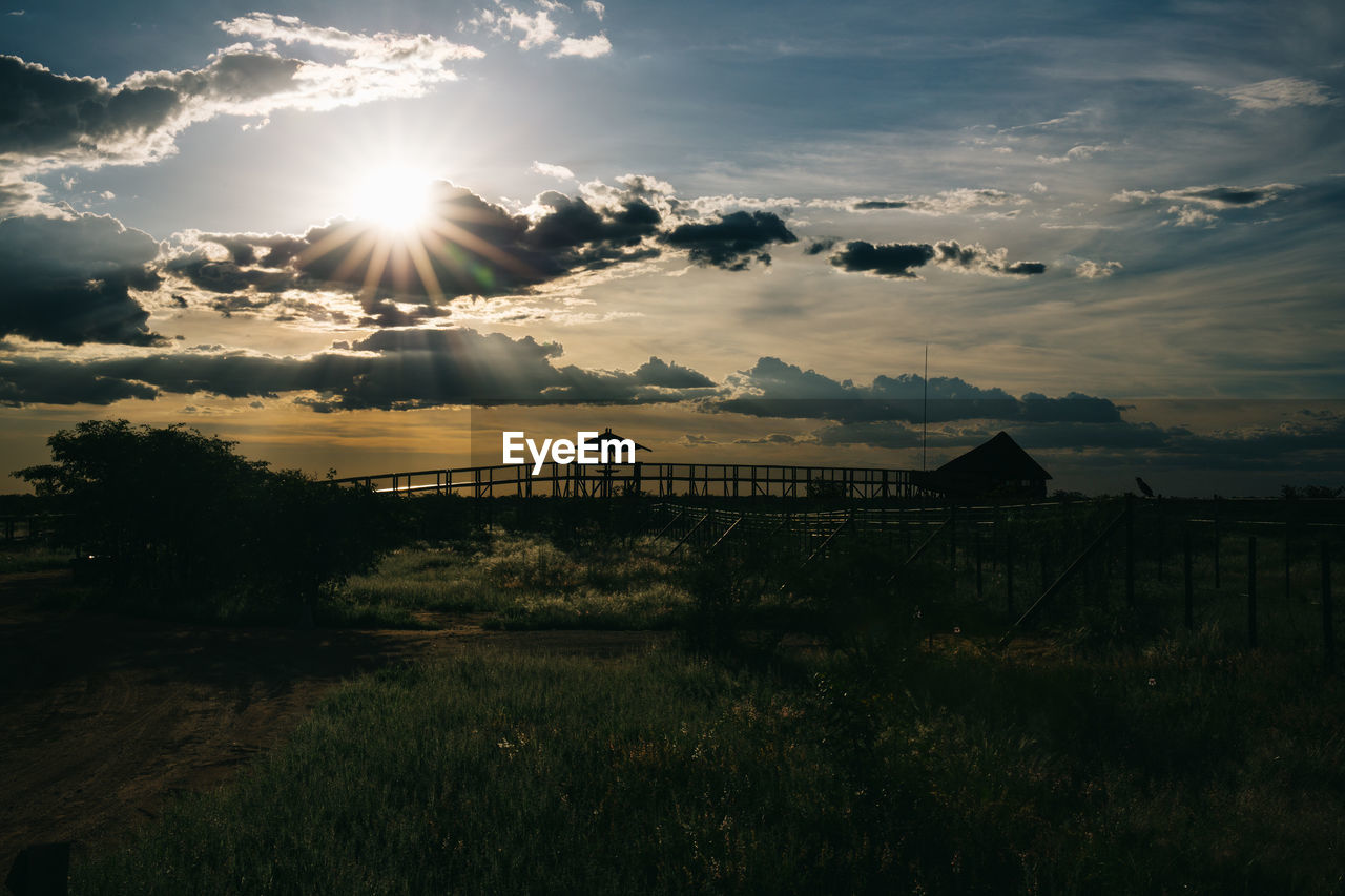 Scenic view of field against sky during sunset