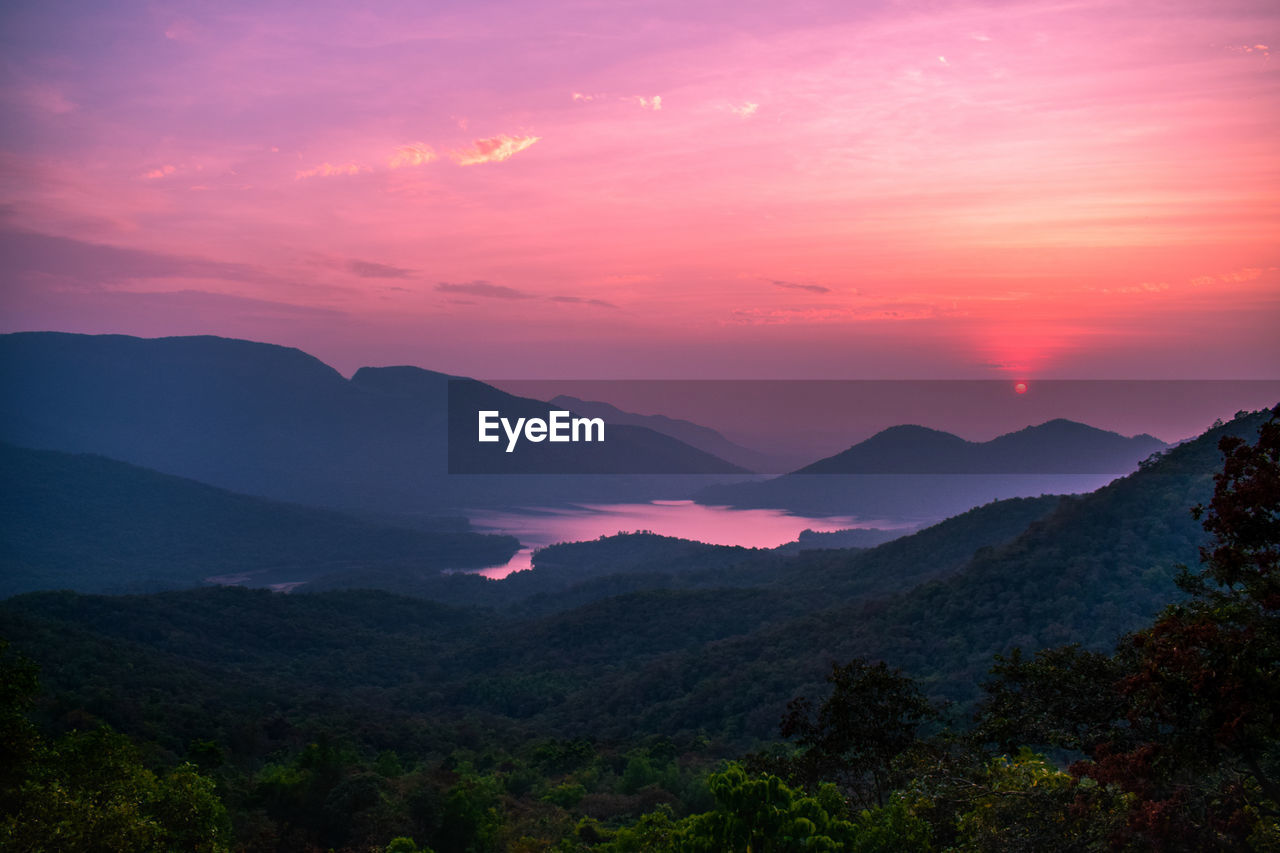 Scenic view of mountains against sky during sunset