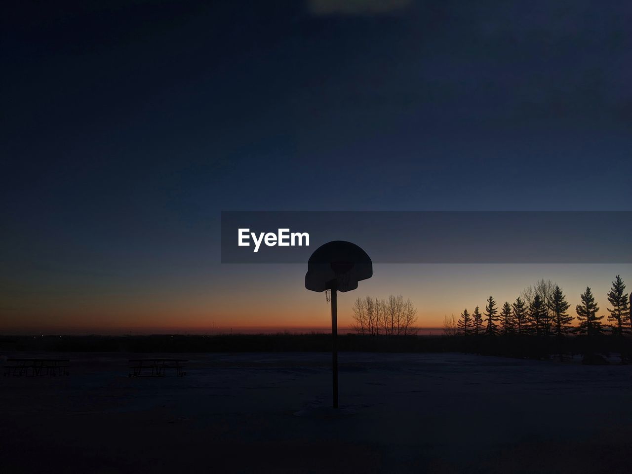 dawn, sky, sunrise, horizon, reflection, nature, morning, no people, cloud, light, sun, darkness, tranquility, communication, scenics - nature, beauty in nature, silhouette, tranquil scene, street light, land, tree, sunlight, plant, outdoors, copy space, sign, moonlight, road sign, landscape, environment