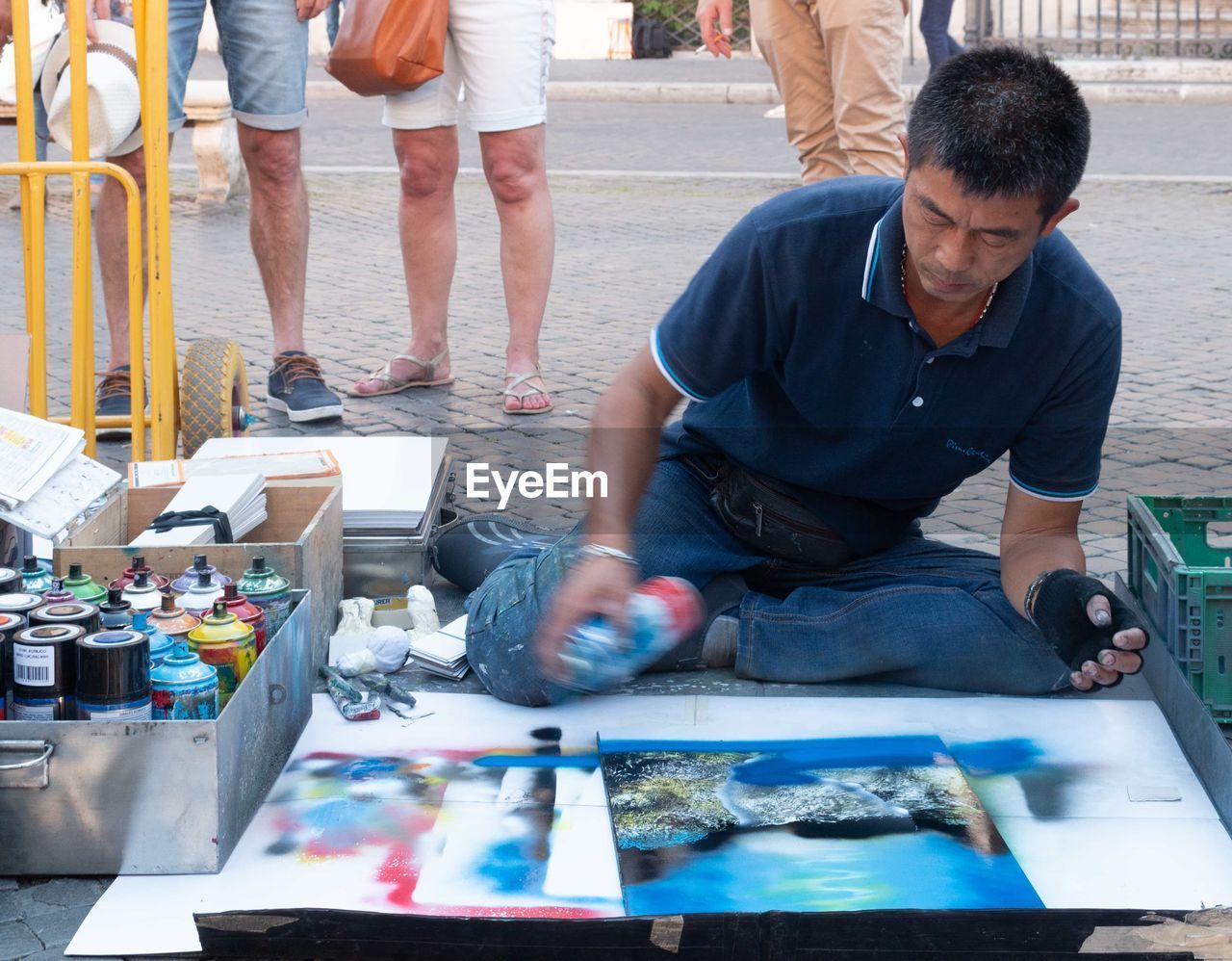 GROUP OF PEOPLE LOOKING AT MARKET