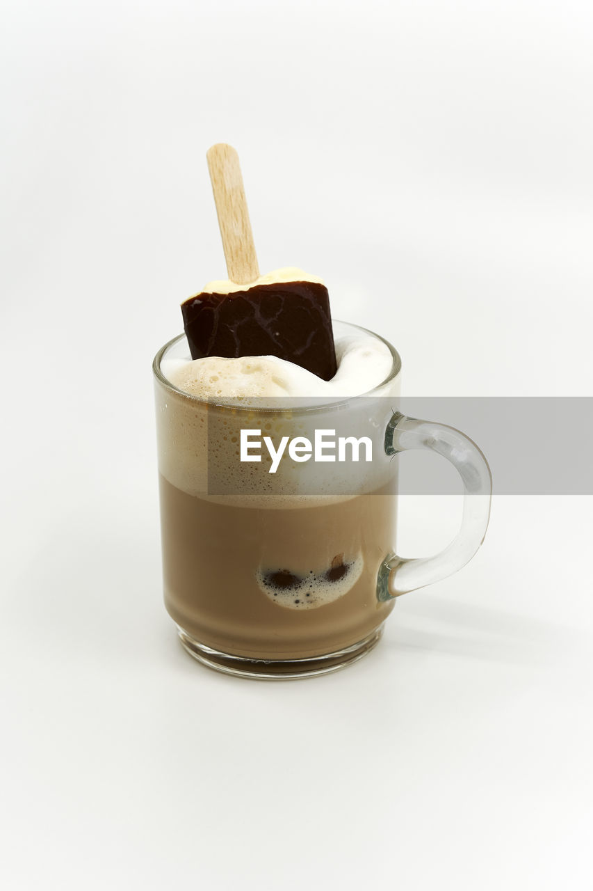 Close-up of coffee cup against white background