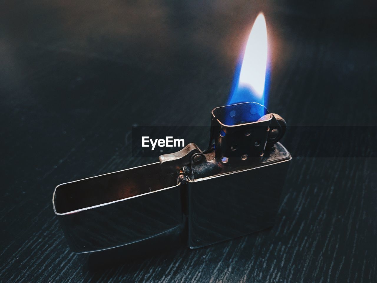 HIGH ANGLE VIEW OF BURNING CANDLE