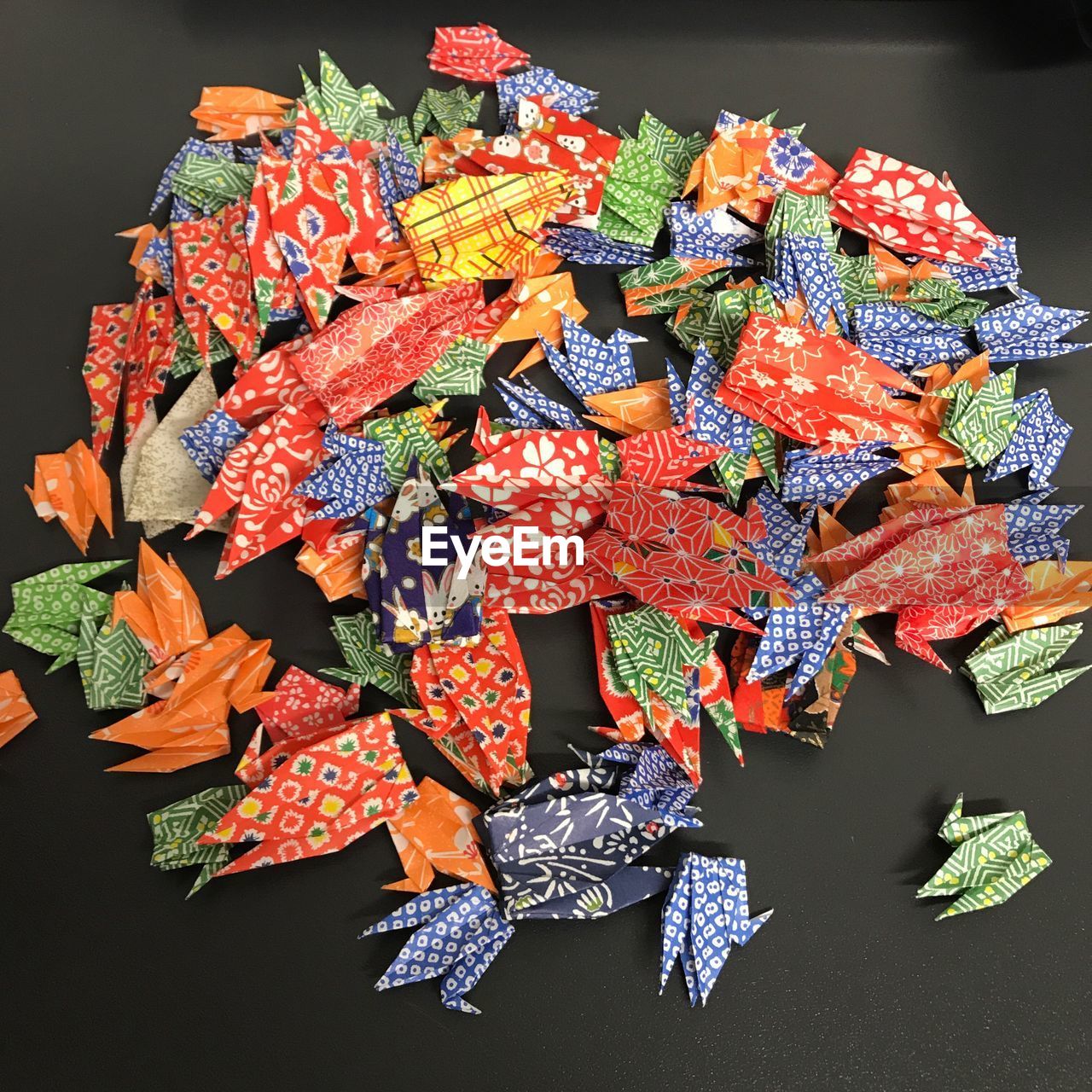 HIGH ANGLE VIEW OF MULTI COLORED UMBRELLAS