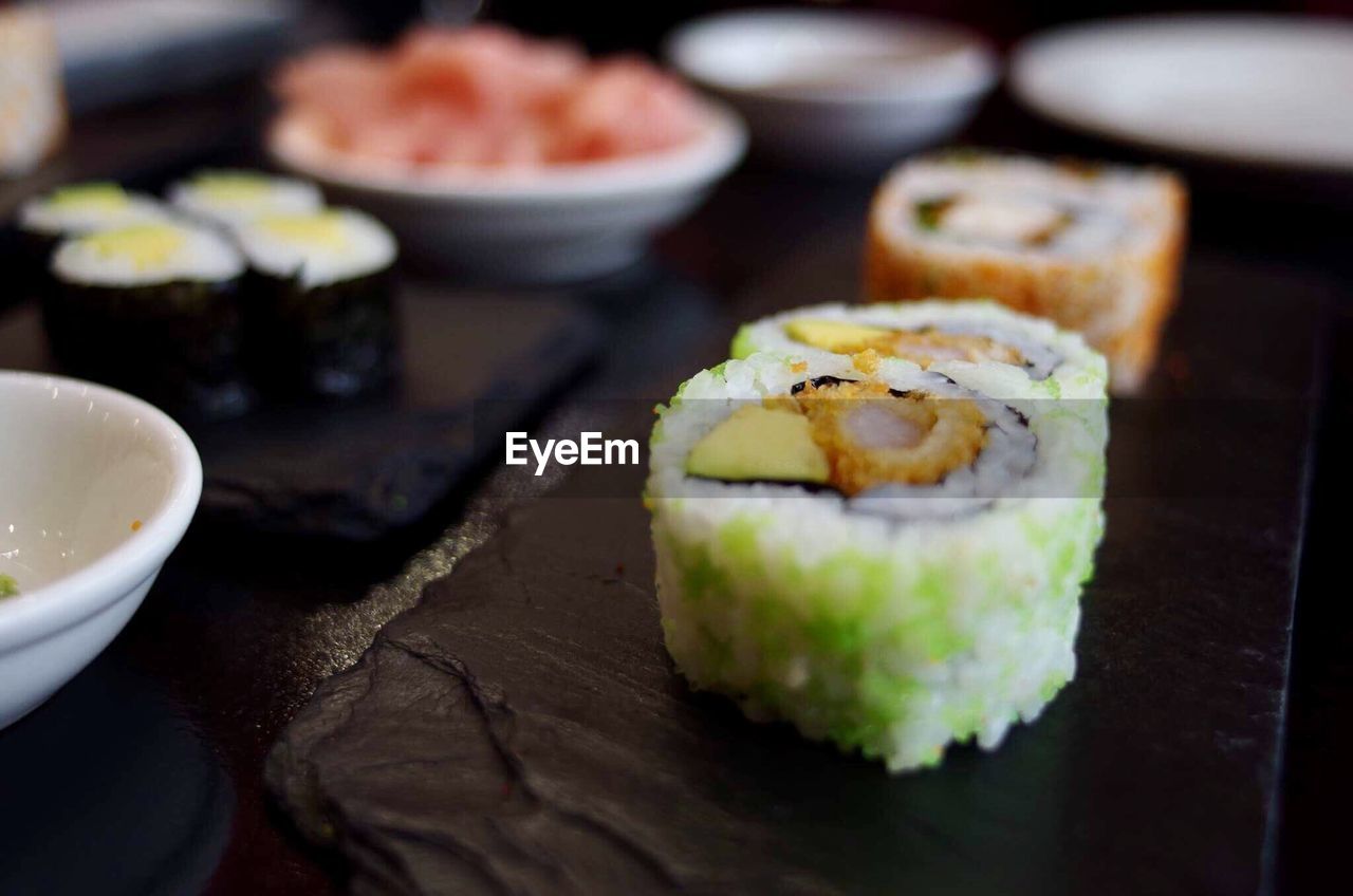 Close-up of sushi served on slate