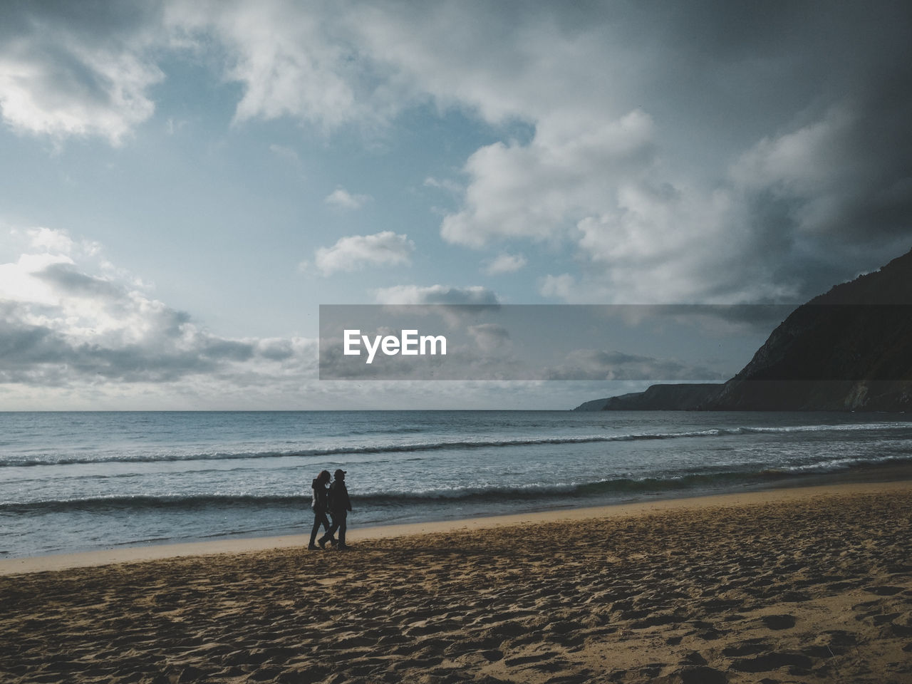 Couple walking at beach