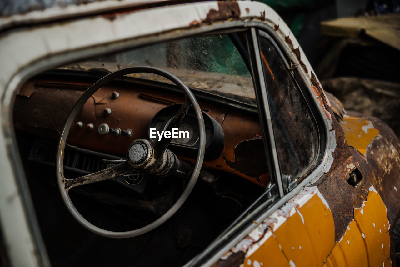 Abandoned car parked outdoors