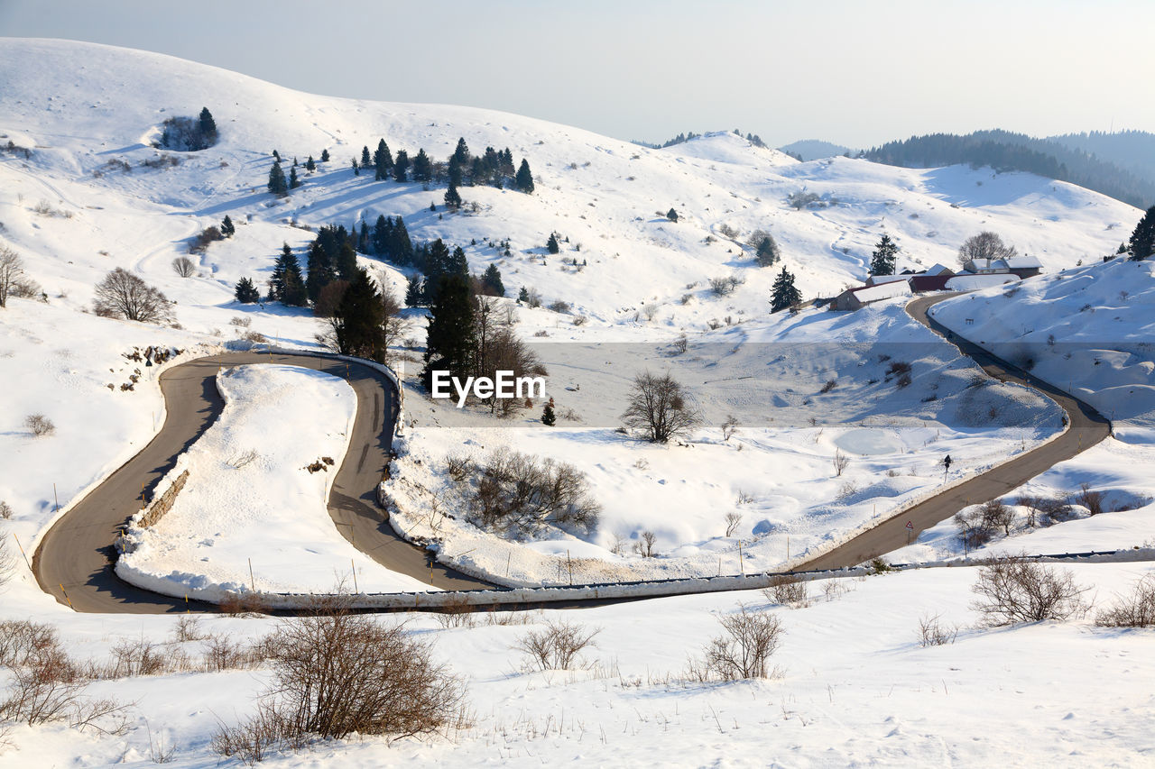 Scenic view of snow covered mountains against sky