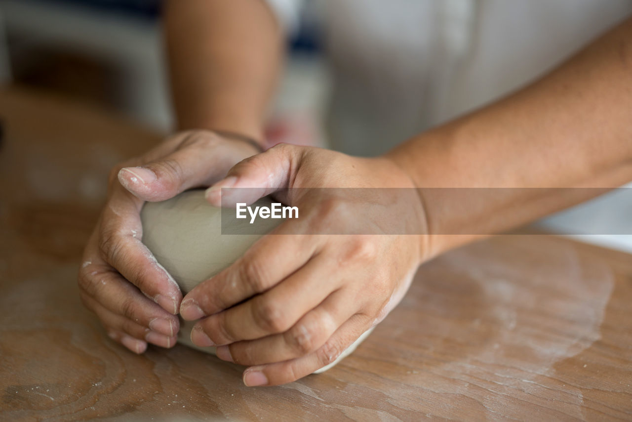 Woman kneading dough