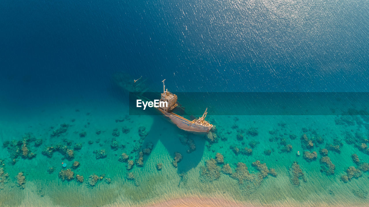 High angle view of people swimming in sea