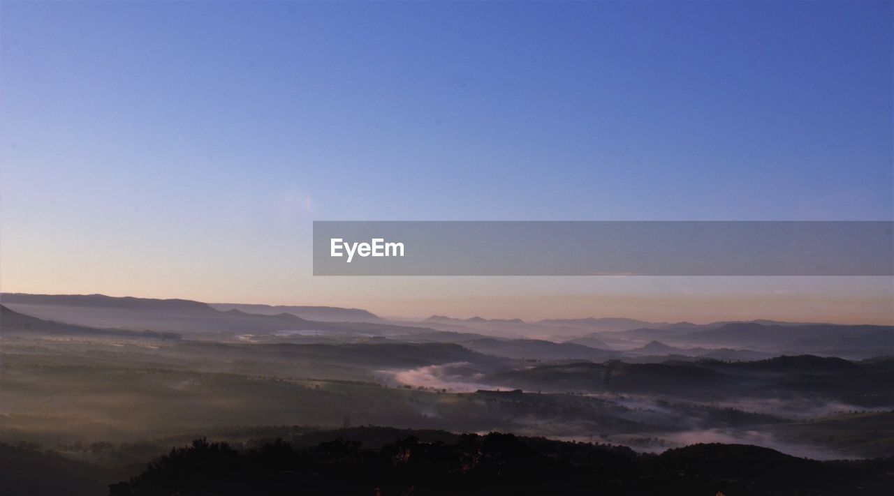 Scenic view of mountains against sky during sunset