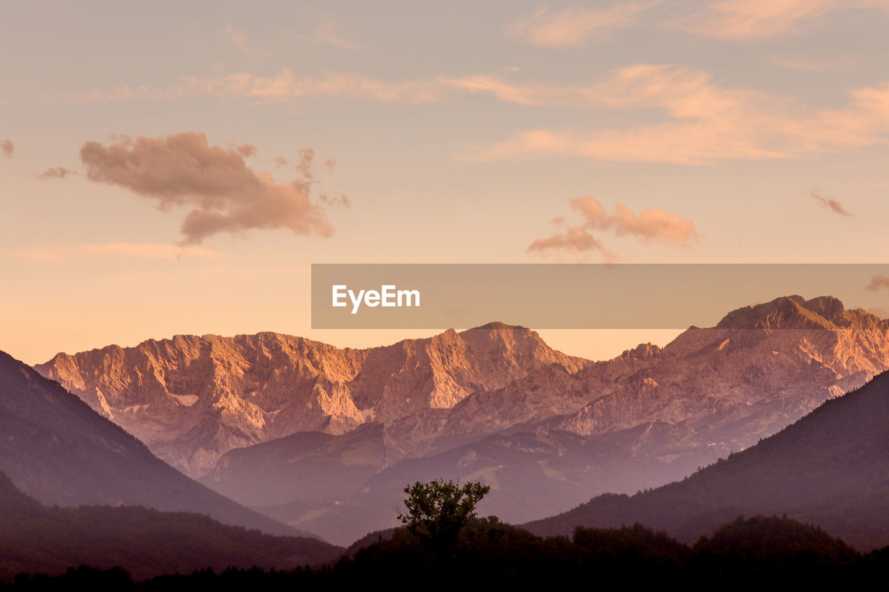 Scenic view of mountains against sky during sunset