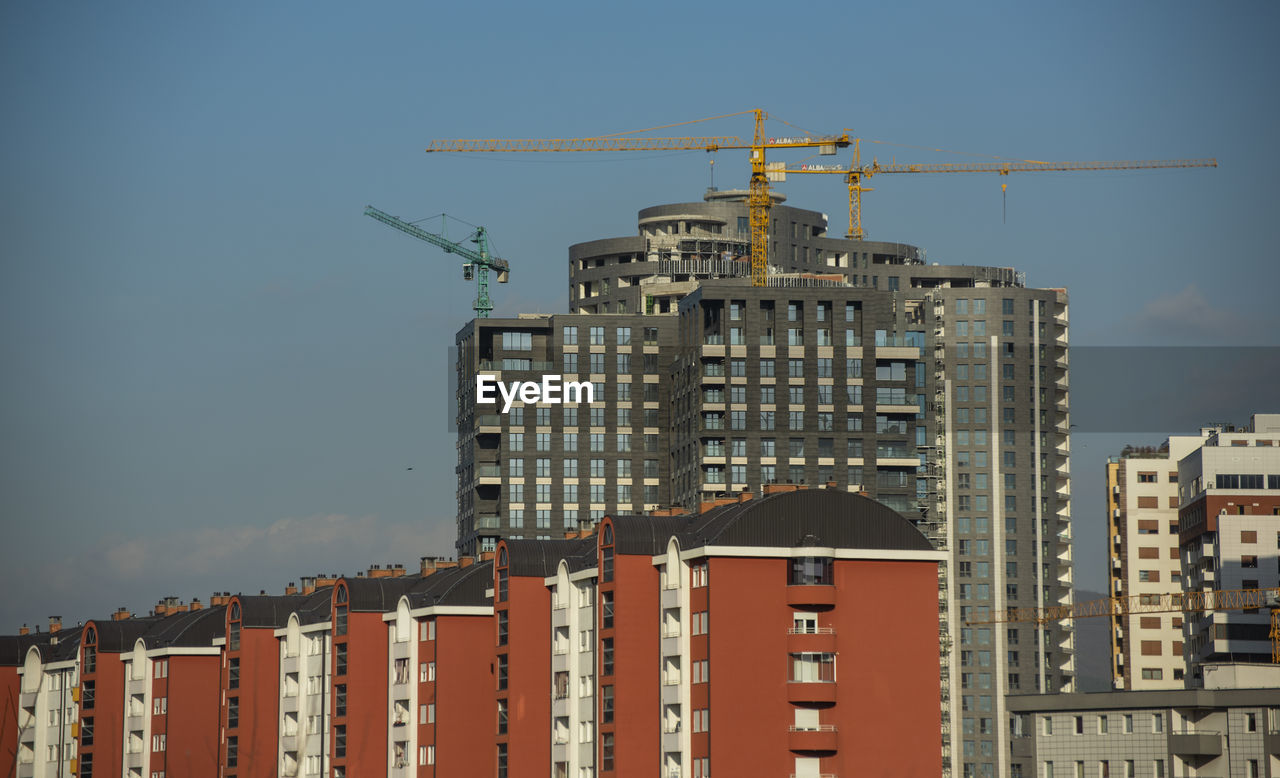 buildings in city against sky