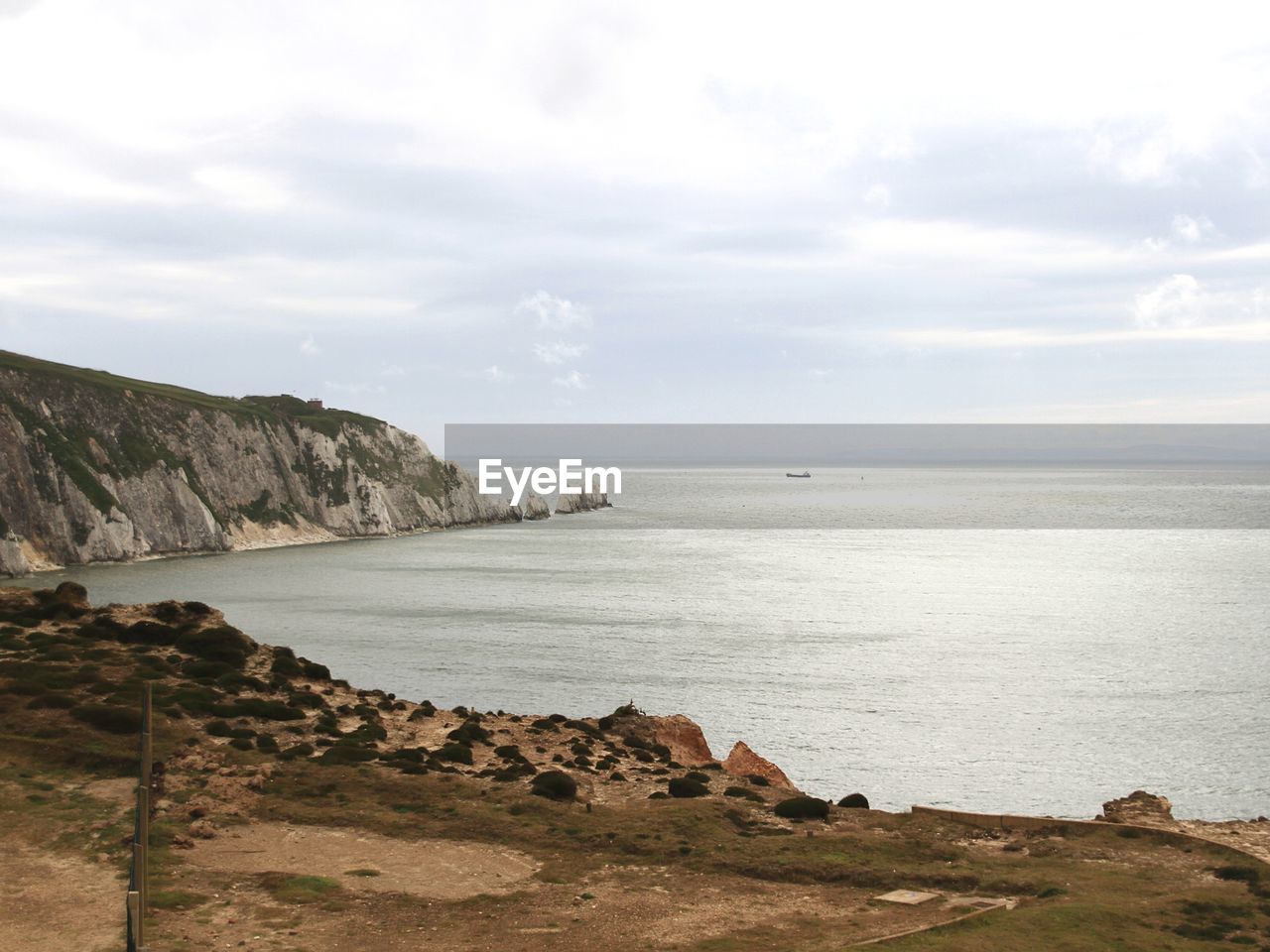 Scenic view of sea and cliff