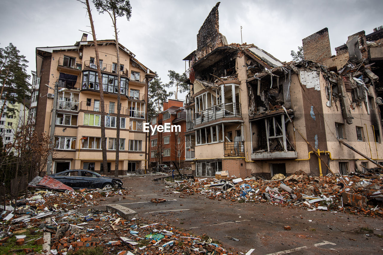 Destroyed buildings on the streets of irpen. broken, shelled windows.