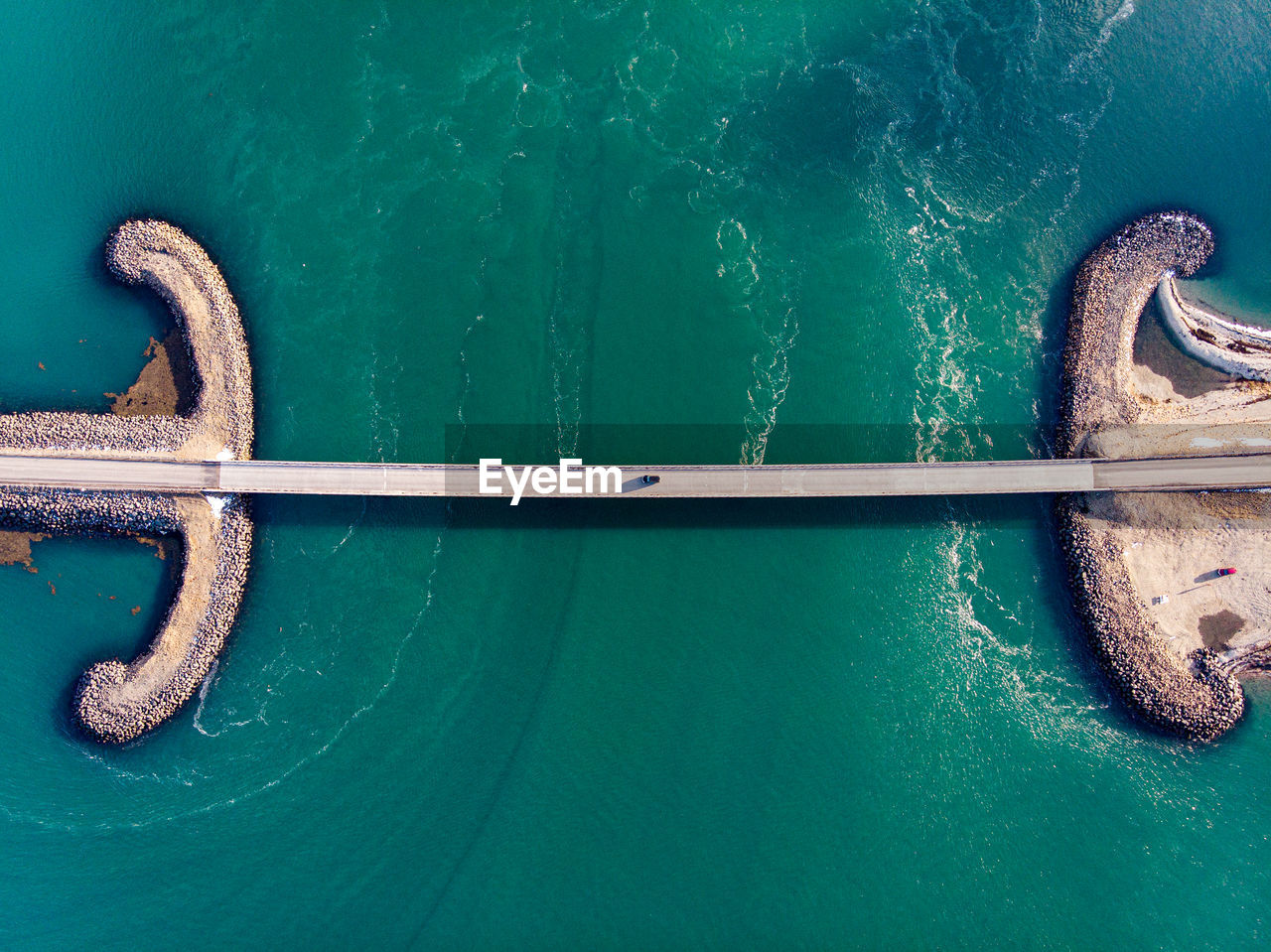 High angle view of ropes on wooden post in sea