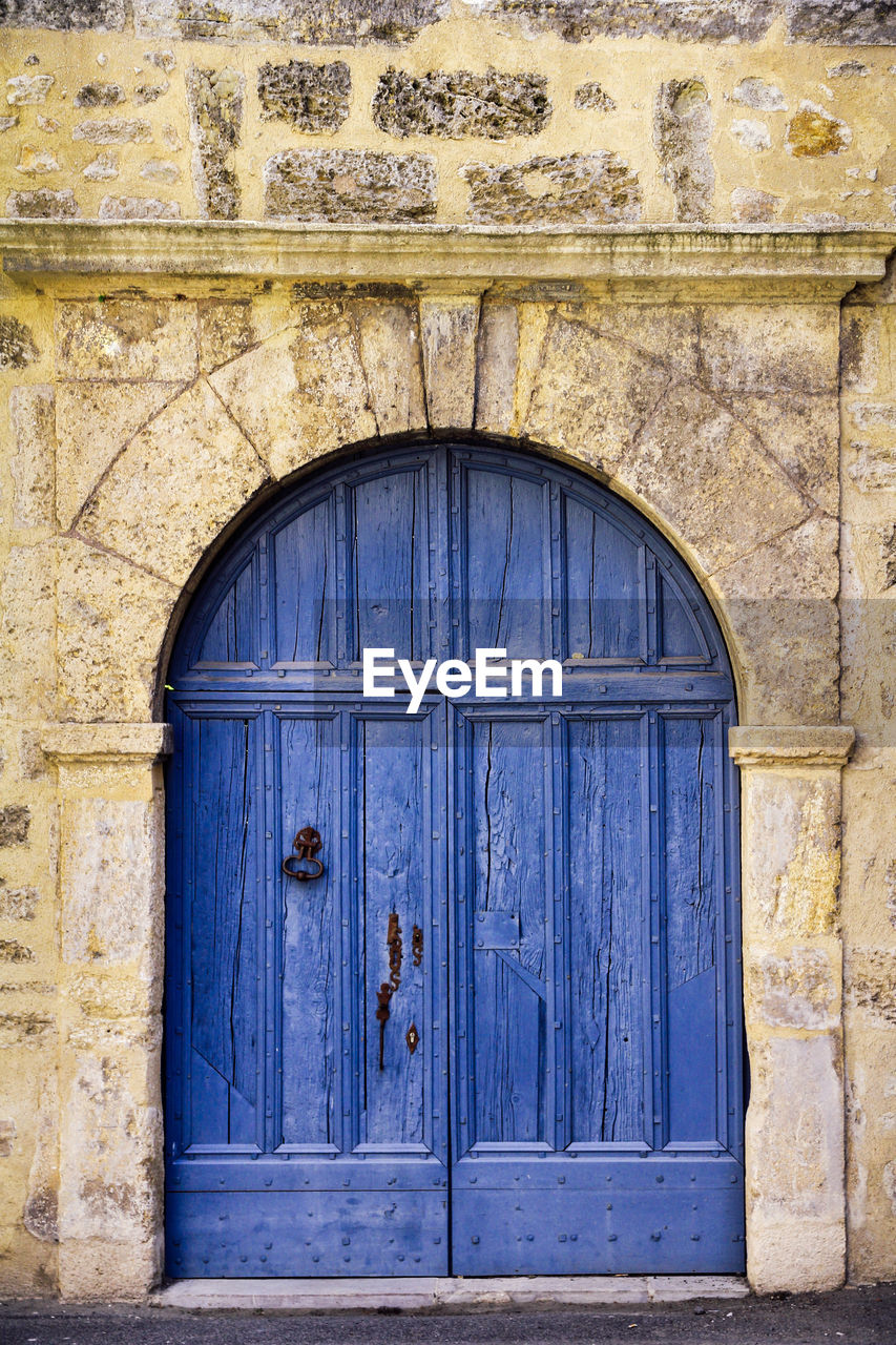 CLOSED DOOR OF OLD HOUSE