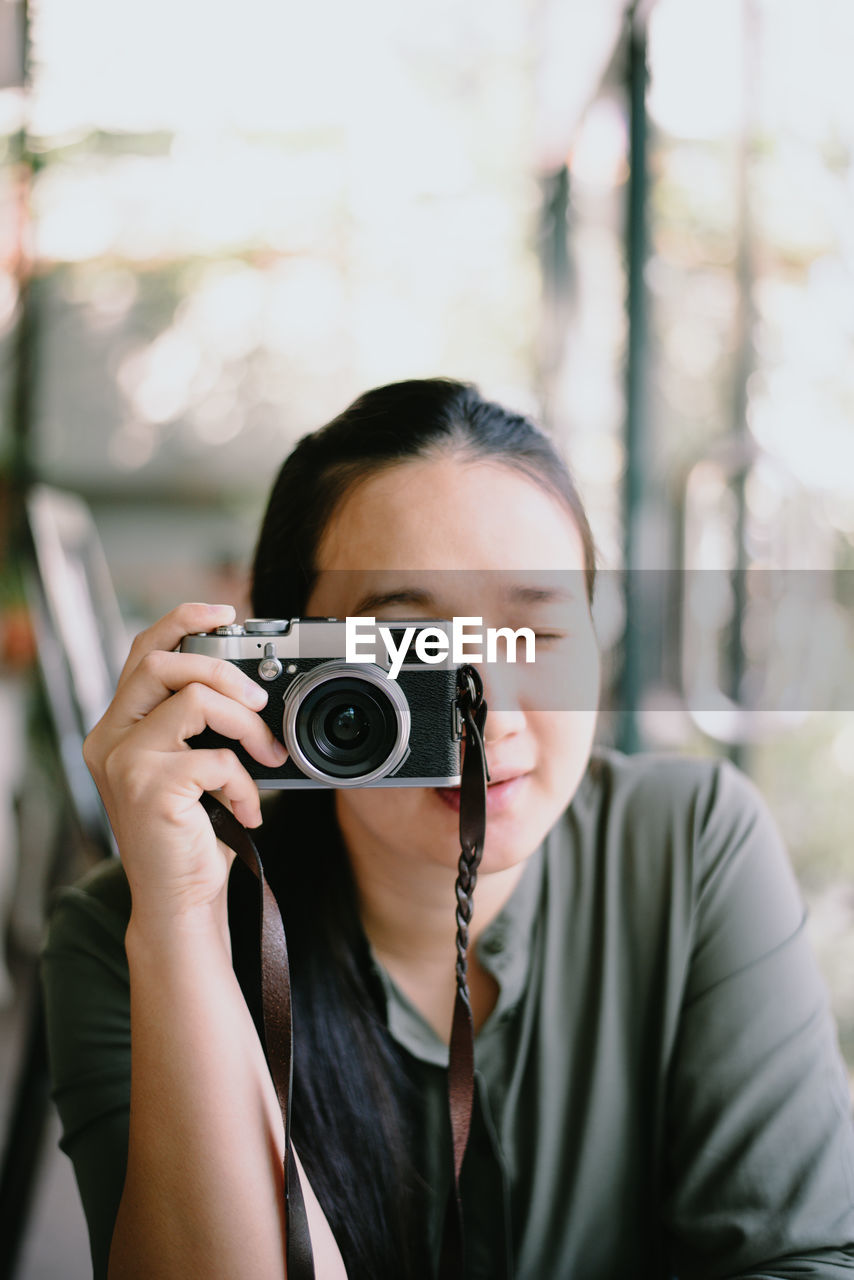 Close-up of woman photographing