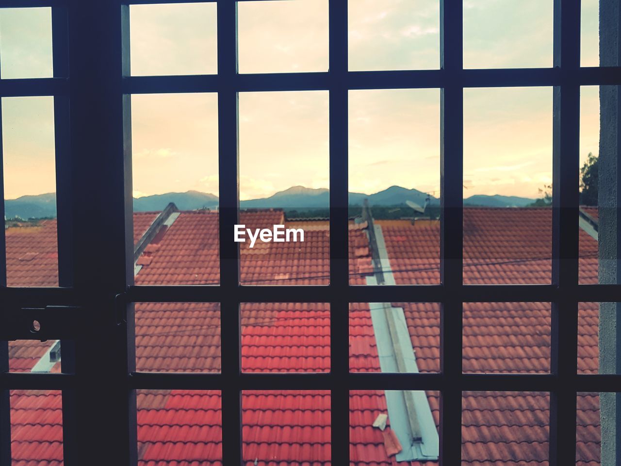CLOSE-UP OF WINDOW AGAINST SKY