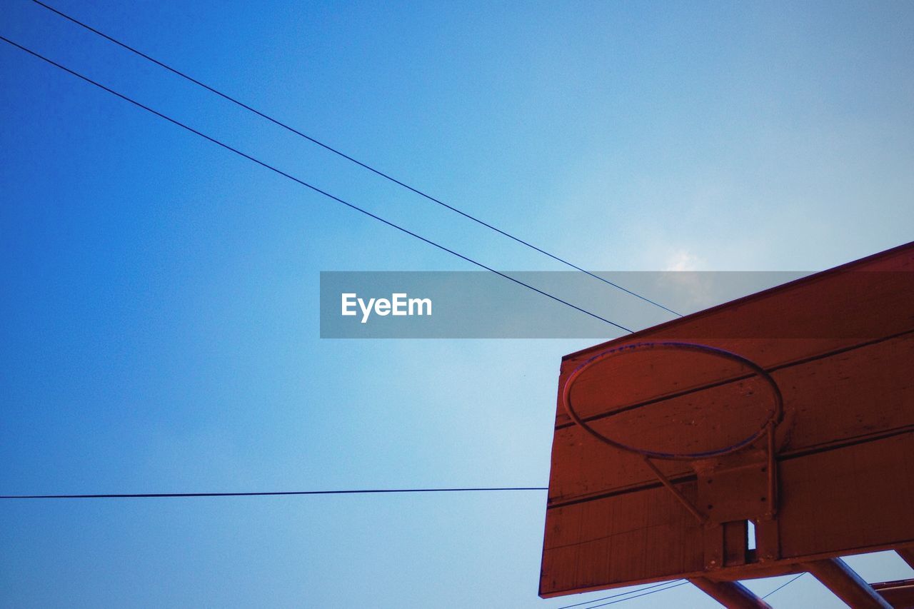 Low angle view of basketball hoop against sky