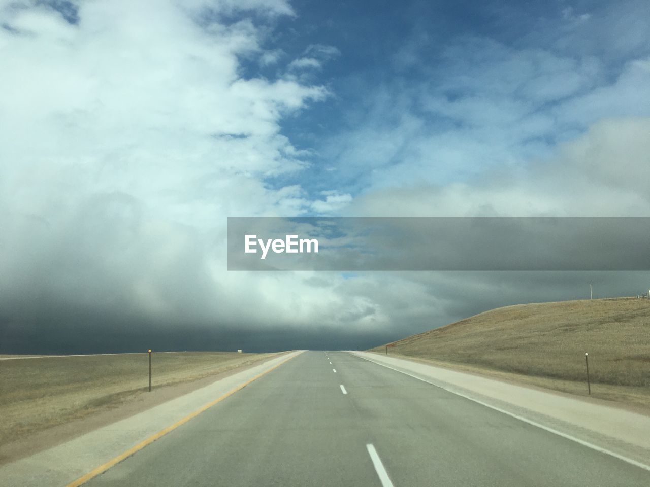 EMPTY ROAD AGAINST SKY