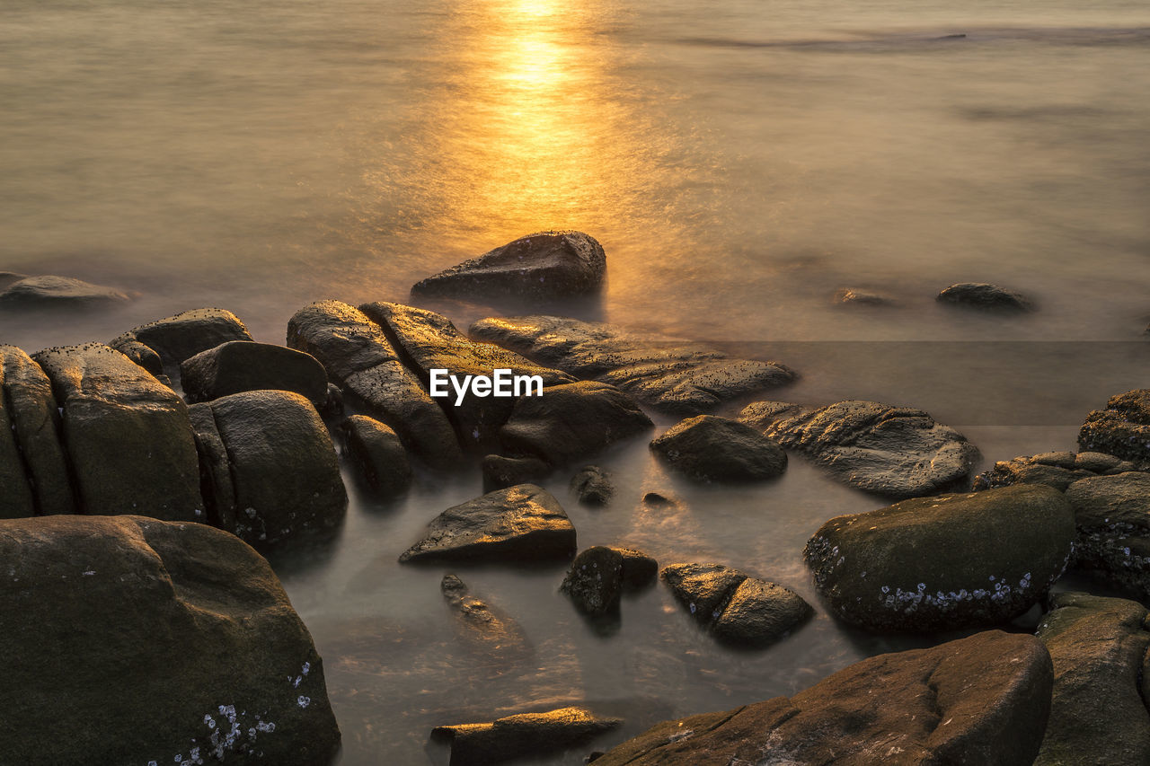 Aerial view of rocks at sea shore