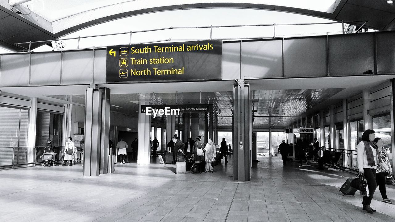 PEOPLE AT RAILROAD STATION PLATFORM