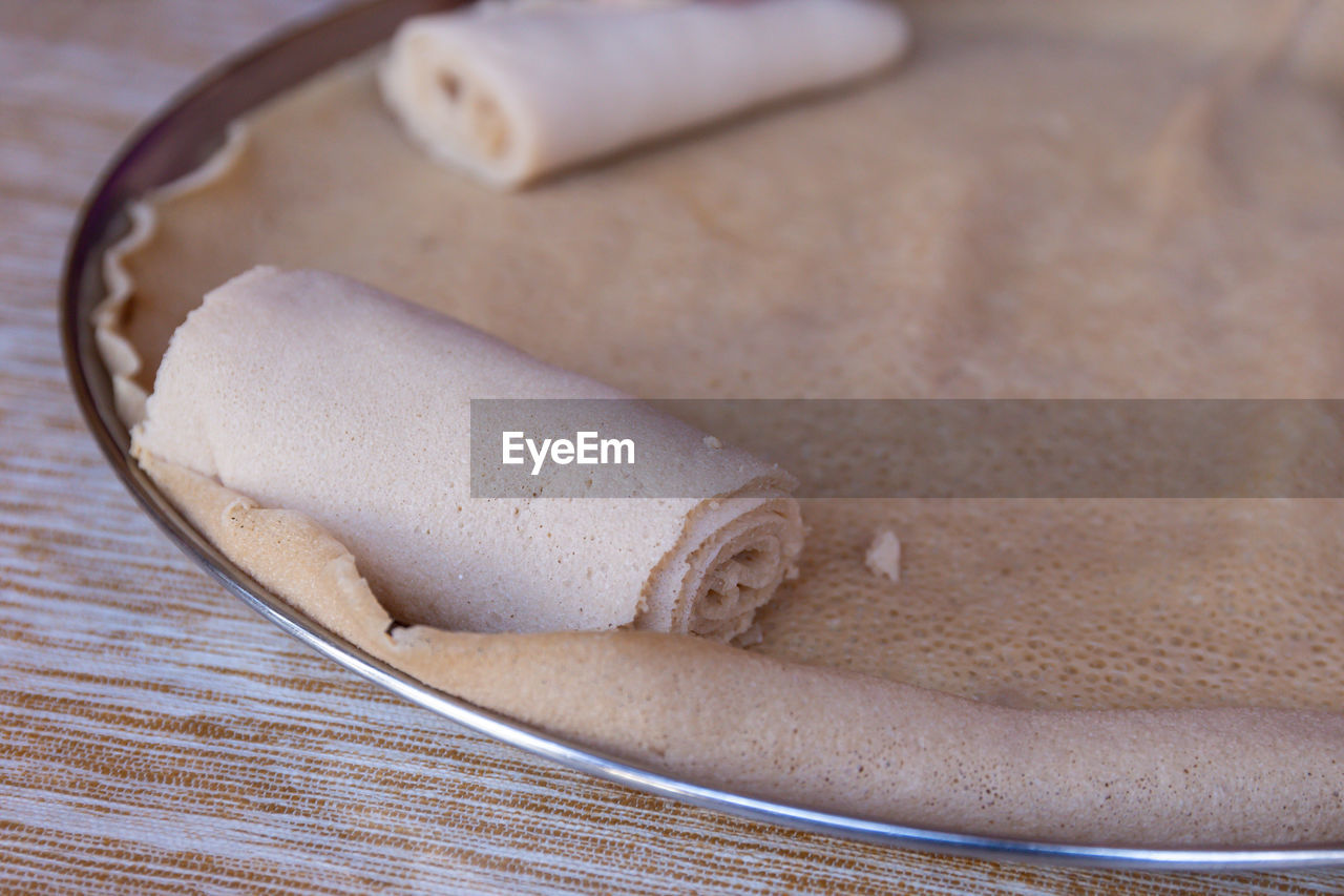 HIGH ANGLE VIEW OF BREAD IN CONTAINER