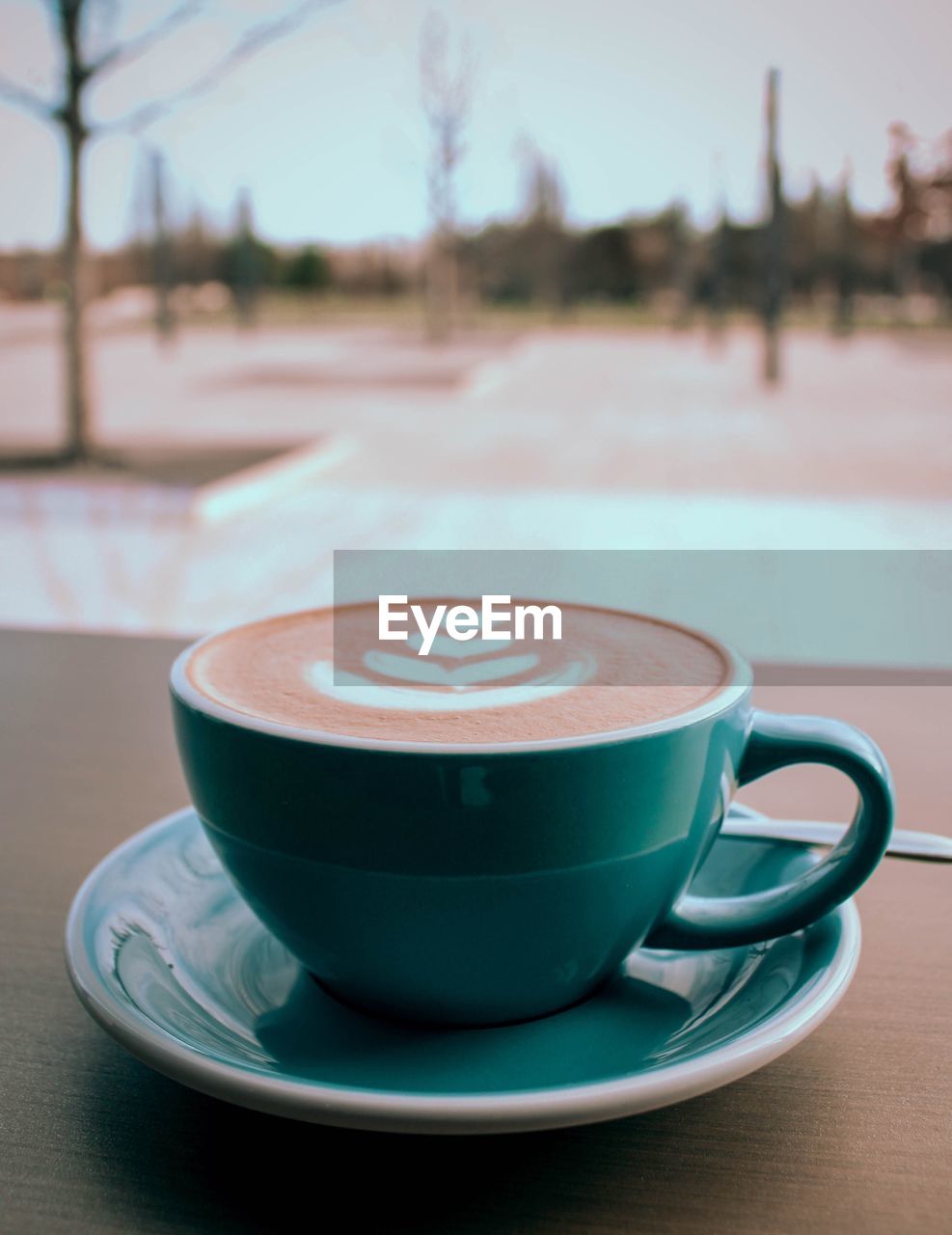 CLOSE-UP OF COFFEE IN CUP ON TABLE