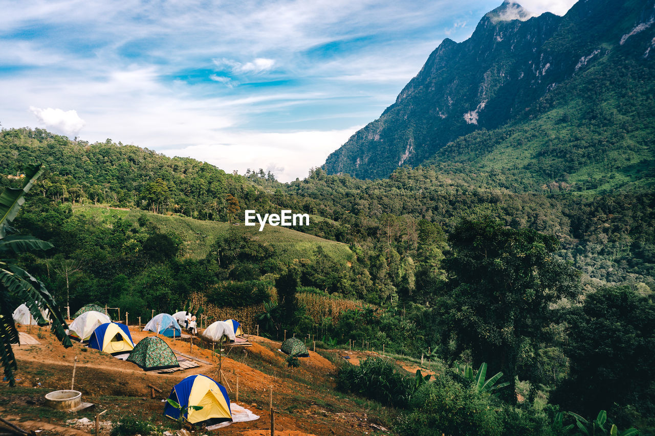 VIEW OF TENT ON MOUNTAIN AGAINST SKY