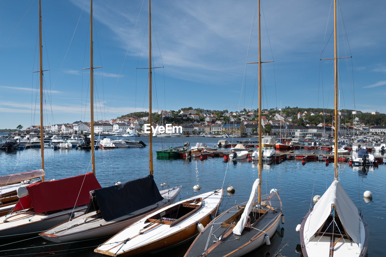 Boats moored at harbor